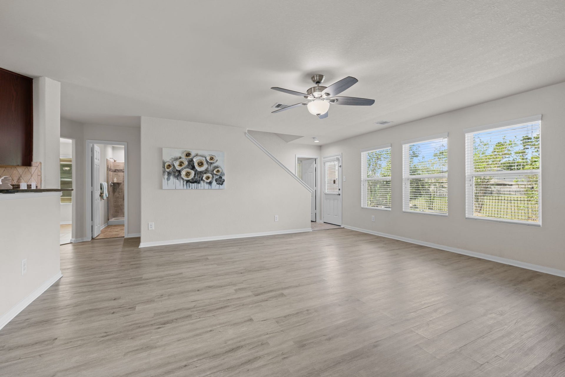 9979 Chimney Swift Lane, Conroe, TX 77385 Family room with view to the back.