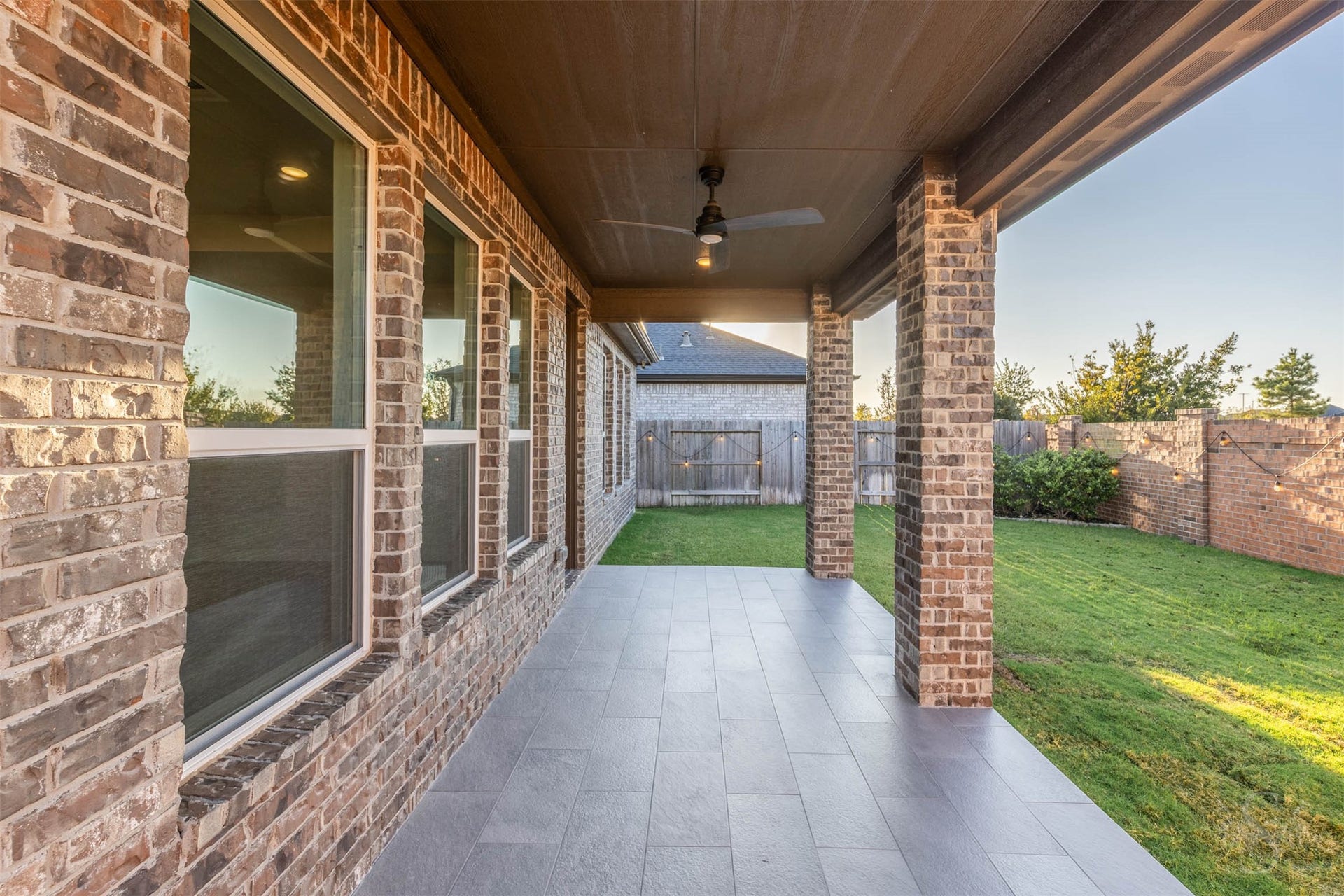 20922 Maudine Drive, Cypress, TX 77433 The spacious covered patio features beautiful tile flooring and a ceiling fan, creating an inviting setting for morning coffee or relaxed evenings with friends. Enjoy views of the fenced back yard with plenty of green space for children and pets to play.