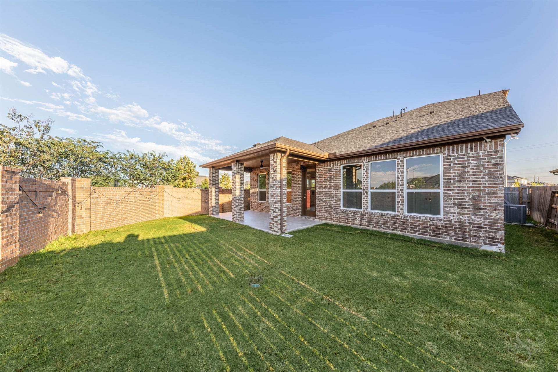 20922 Maudine Drive, Cypress, TX 77433 The spacious back yard offers plenty of green space for playing, gardening or enjoying the sunshine. A covered patio framed by brick columns provides an inviting spot to relax or entertain friends.
