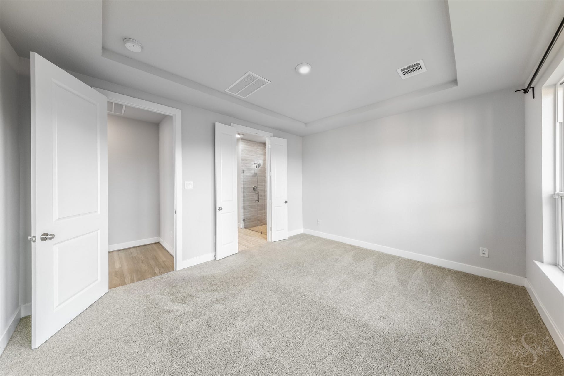 20922 Maudine Drive, Cypress, TX 77433 Generous wall space provides flexibility for arranging your bedroom furniture beneath the beautiful tray ceiling. Double doors lead into the private primary bath, completing this comfortable retreat.