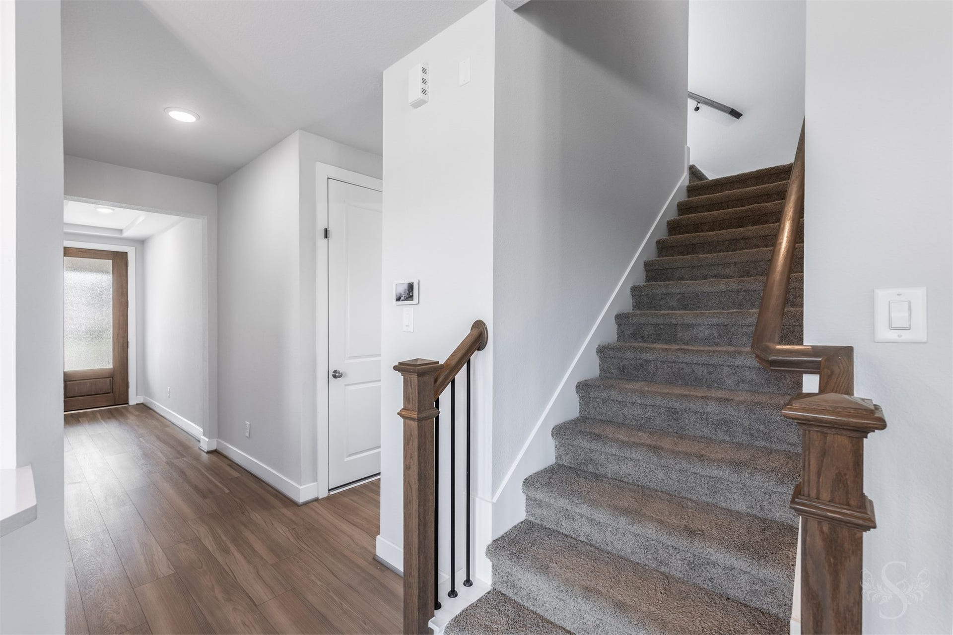 20922 Maudine Drive, Cypress, TX 77433 The staircase features rich wood handrails and iron balusters. Upstairs, three bedrooms and a spacious game room provide plenty of space for family living.