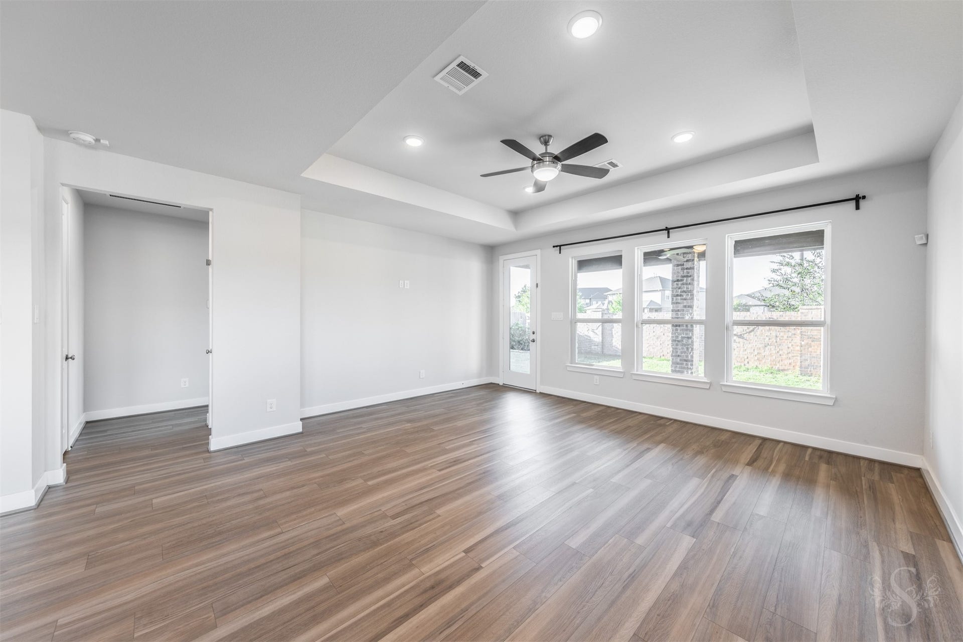 20922 Maudine Drive, Cypress, TX 77433 Three large windows brighten the inviting family room while offering views of the back yard. A door to the covered patio makes it easy to take the gathering outside for a relaxing evening with family and friends.