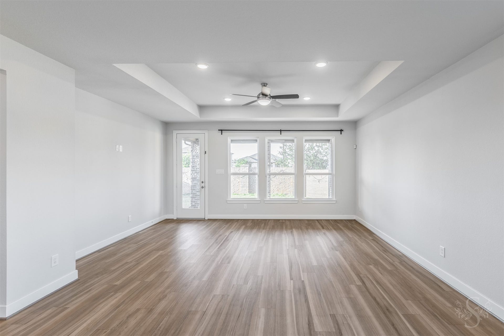 20922 Maudine Drive, Cypress, TX 77433 Three large windows brighten the inviting family room while offering views of the back yard. A door to the covered patio makes it easy to take the gathering outside for a relaxing evening with family and friends.