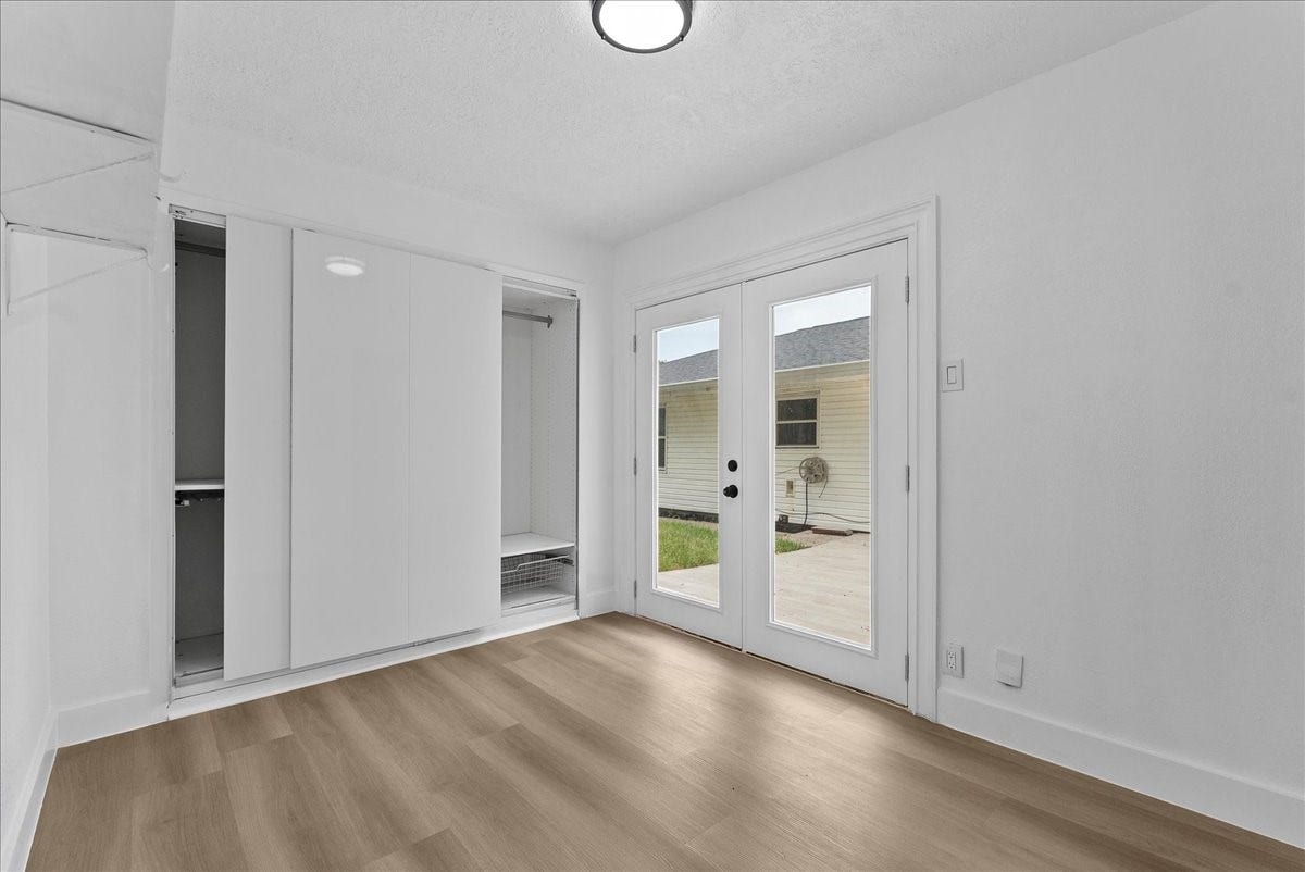 11510 Mullins Drive, Houston, TX 77035 Bright living area with elegant French doors leading to the backyard.