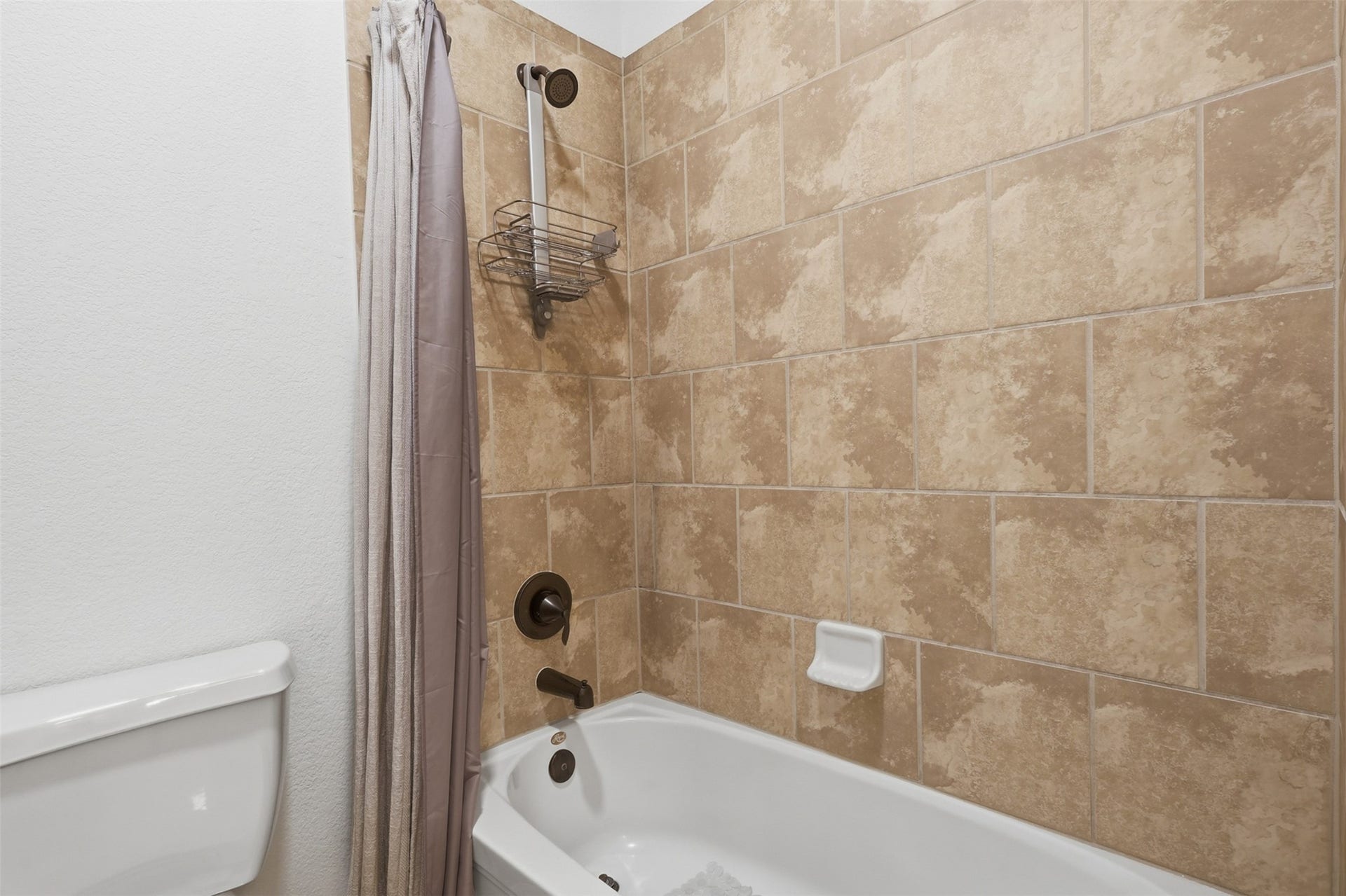 The additional full bathroom with spacious vanity also has a tub/shower combination.