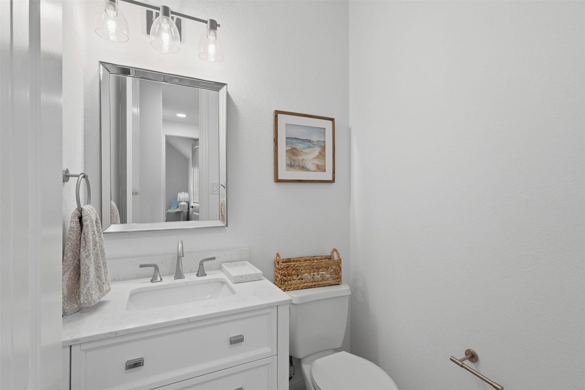 Convenient half bath offers a stylish and functional space for guests.