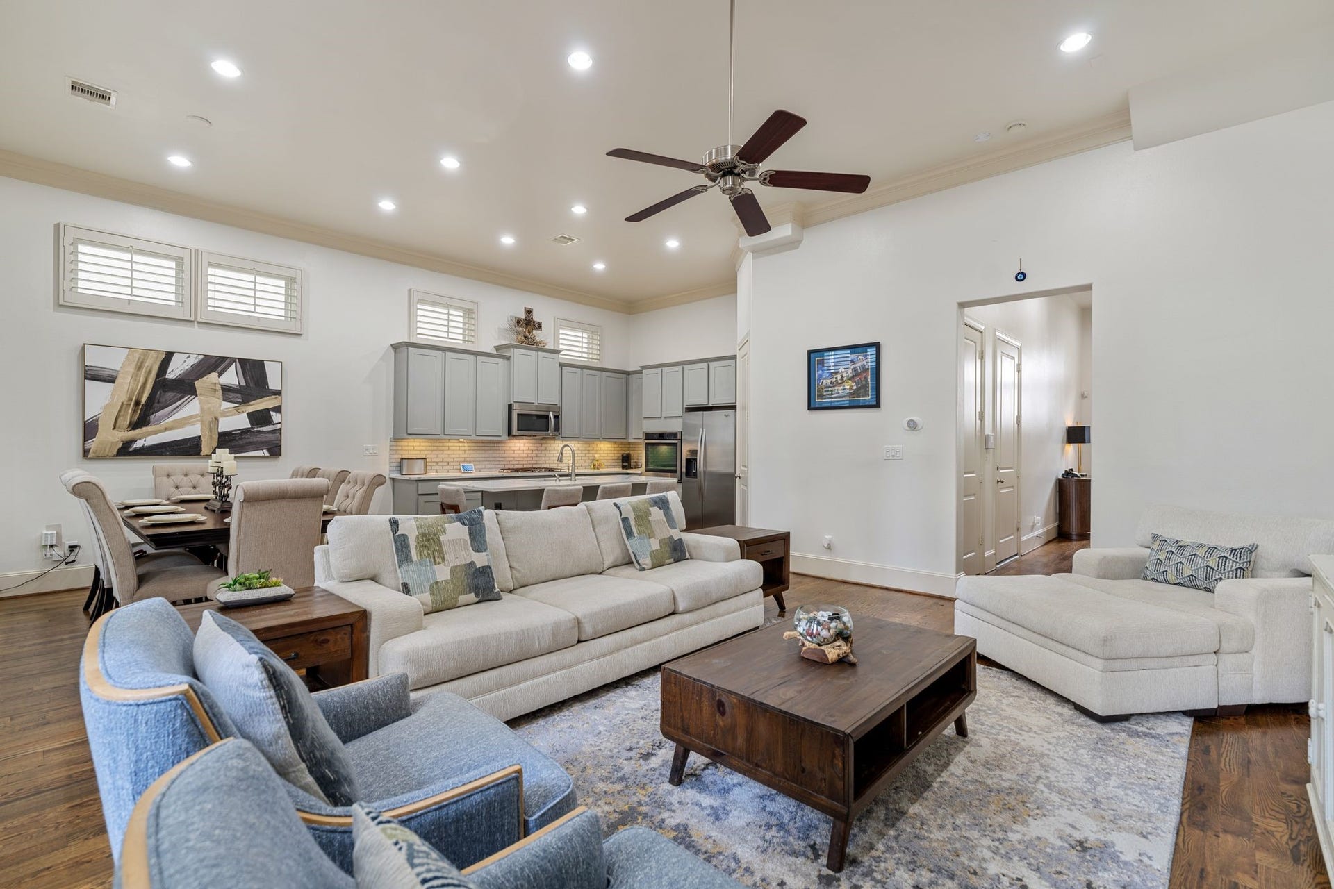 1337 W 24th Street, Houston, TX 77008 This wider view showcases the open connection between the living room, dining area and kitchen, keeping conversation flowing throughout the main living space.