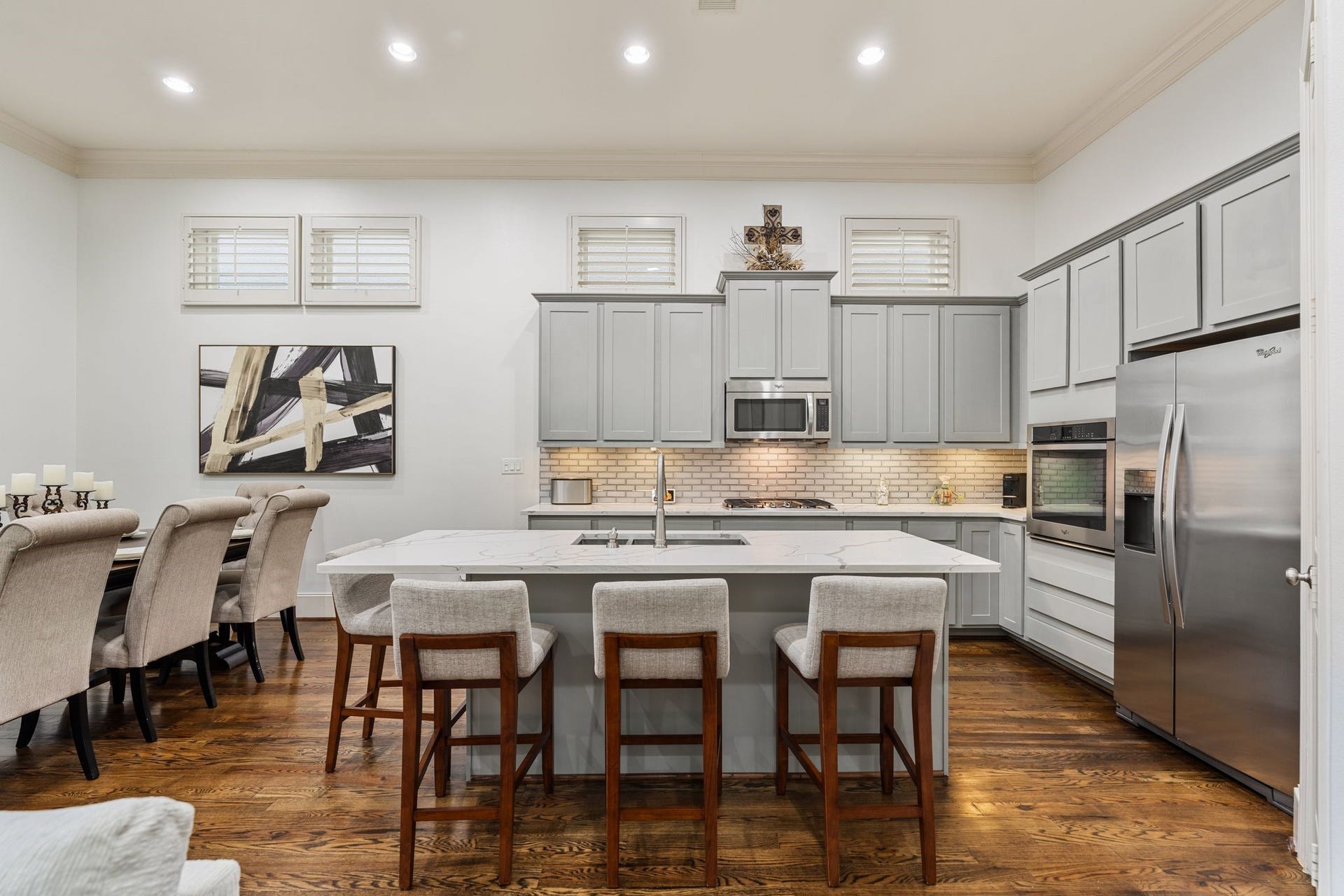 1337 W 24th Street, Houston, TX 77008 Pull up a seat at the generous island, where casual dining complements the kitchens abundant storage and preparation space.