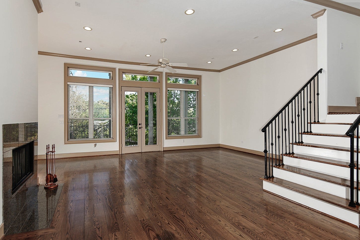 Family Room with a wall of windows and Balcony access