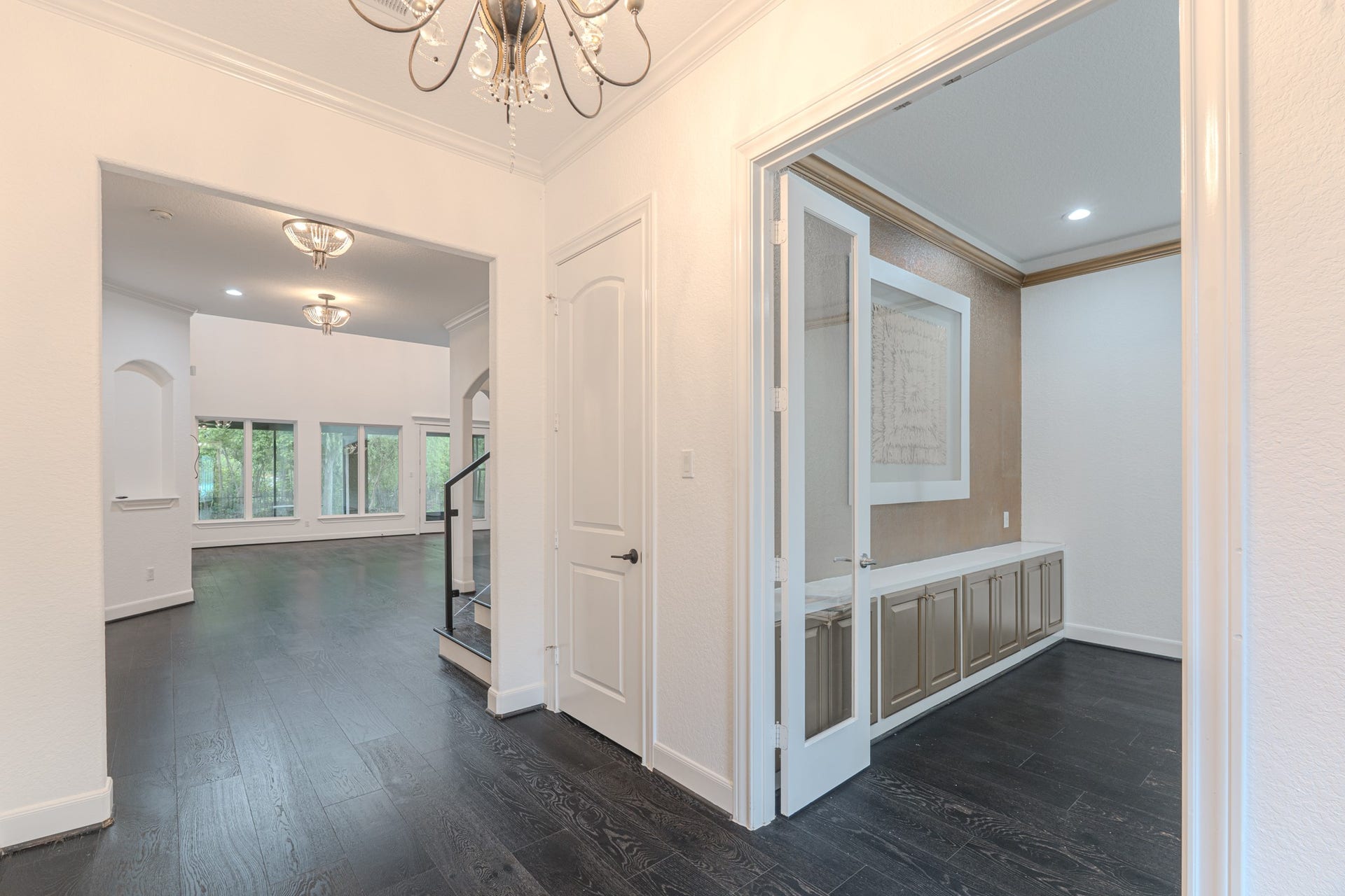 58 Flamingo Landing Drive, Missouri City, TX 77459 Views from the entry, coat closet, crown molding throughout, seamless engineered hardwood floors, study or home office to the right.