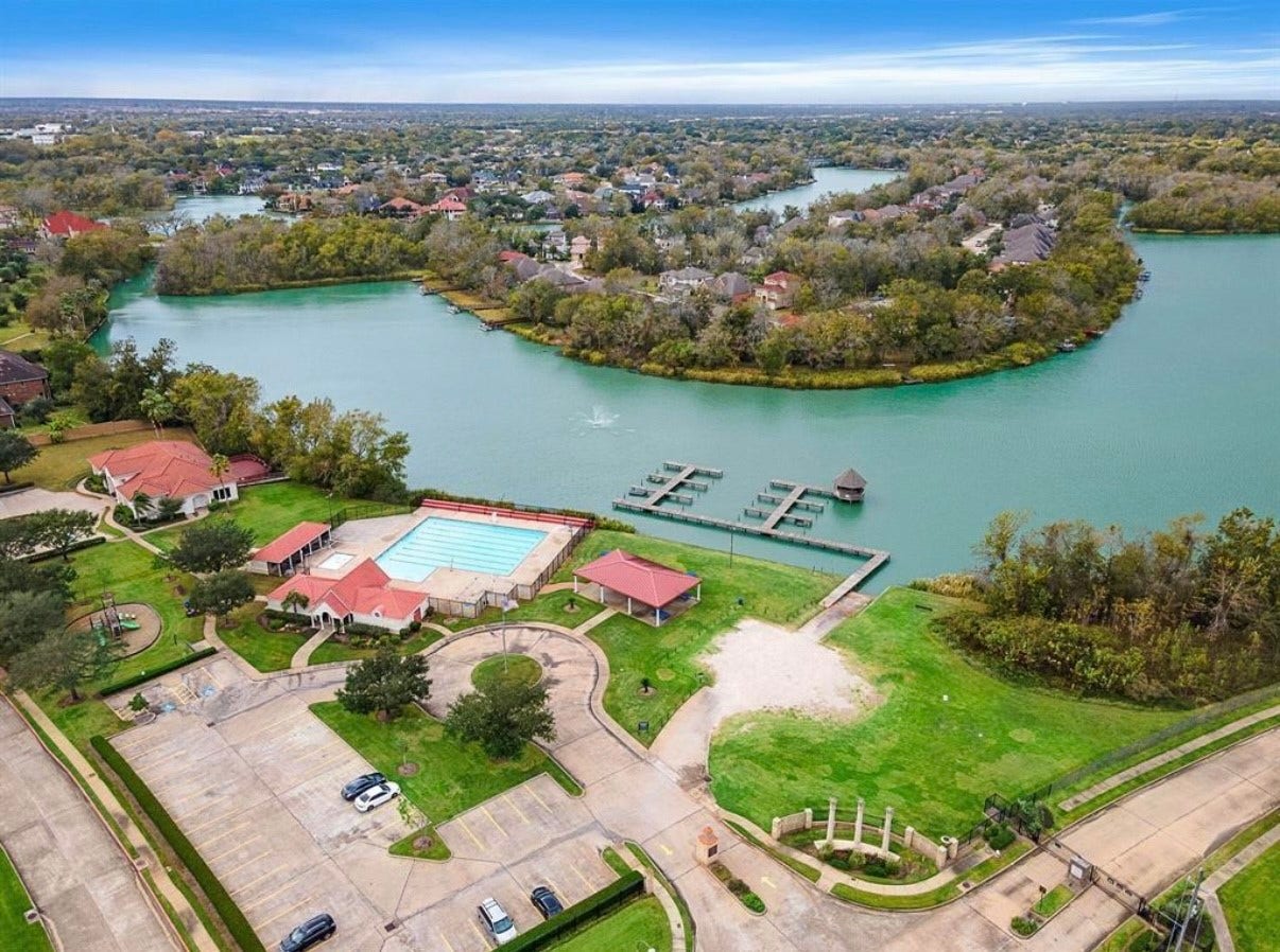 58 Flamingo Landing Drive, Missouri City, TX 77459 Private Clubhouse, Pool, Boat dock and lake access.