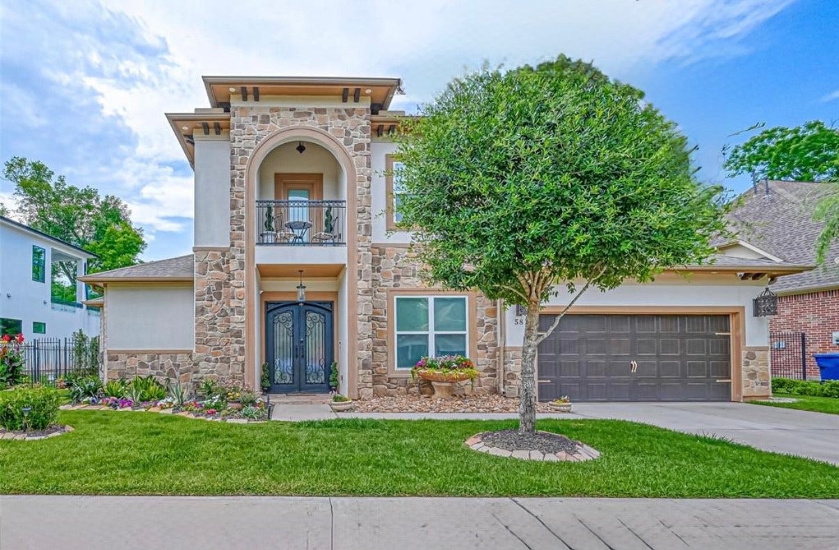 58 Flamingo Landing Drive, Missouri City, TX 77459 A fine stucco and stone esthetic, with balcony. This home is luxurious both inside and out.