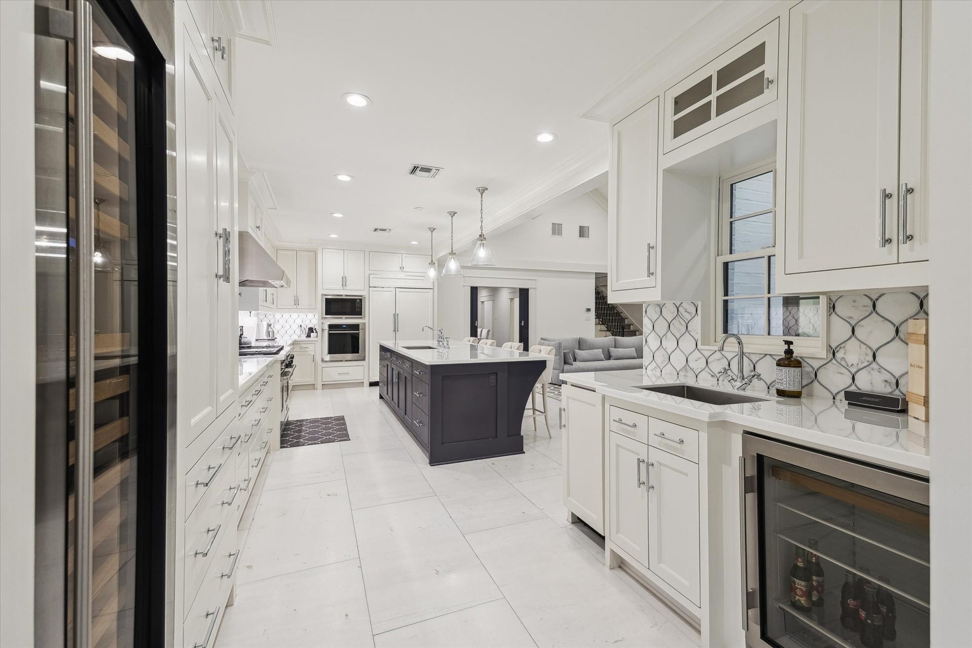 1702 South Boulevard, Houston, TX 77098 Dramatic built-in wine wall and wine refrigerator.