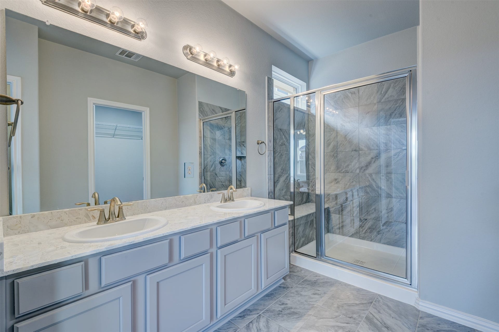 2202 Windy Grove Drive, Texas City, TX 77568 Primary suite offers 2 sinks at the vanity and over-sized walk-in shower with seat