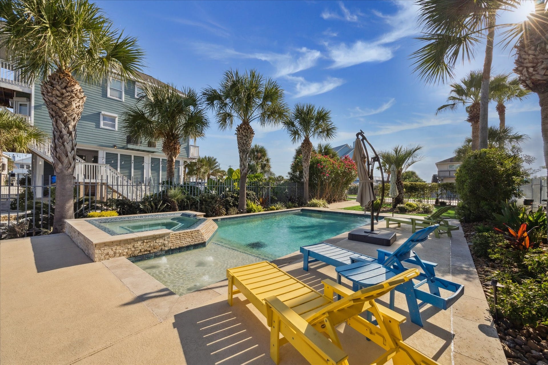 241 Tamana Drive, Tiki Island, TX 77554 pool has the beach level for the babies and dog swimmers