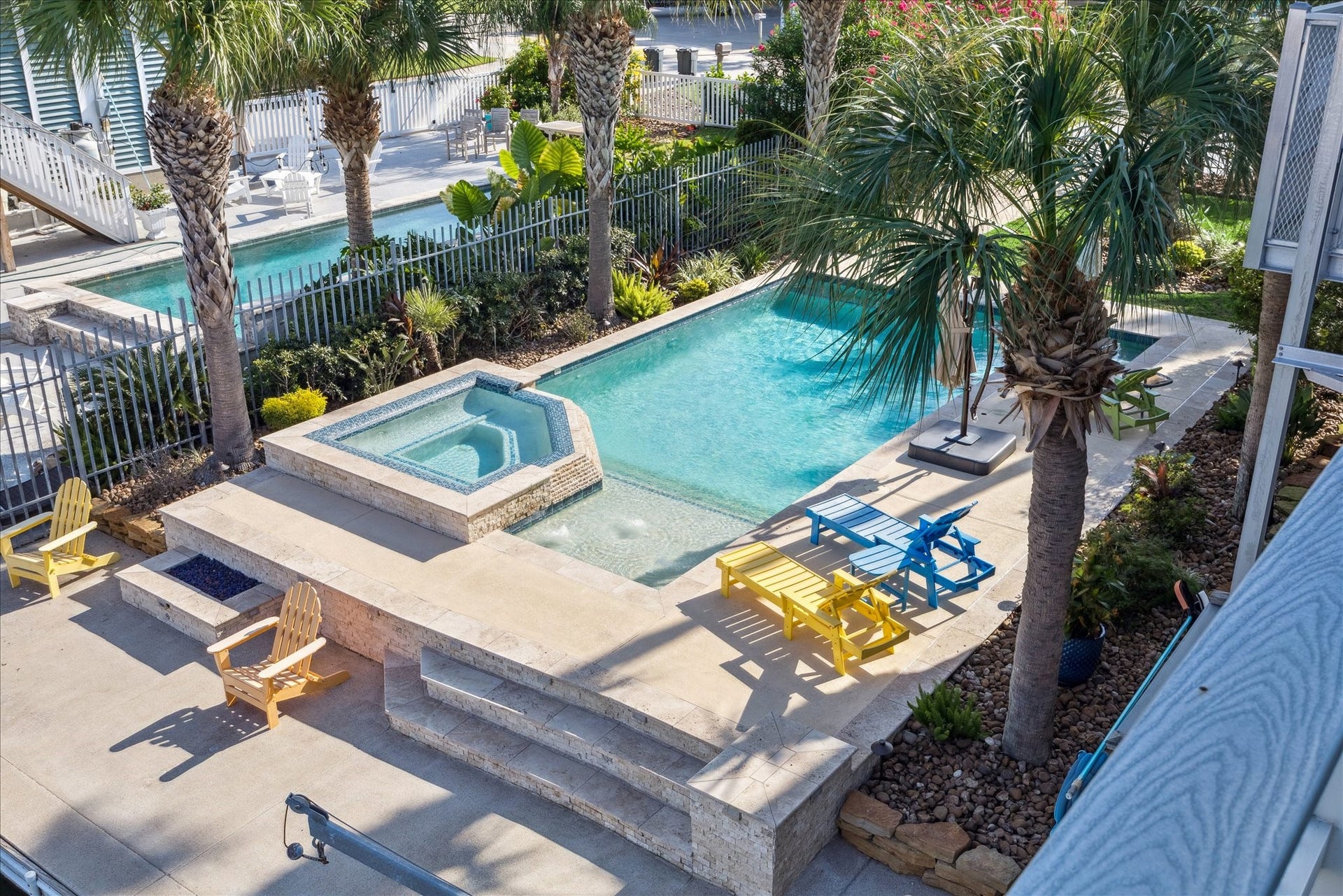 241 Tamana Drive, Tiki Island, TX 77554 pool view illustrating the fire pit fun