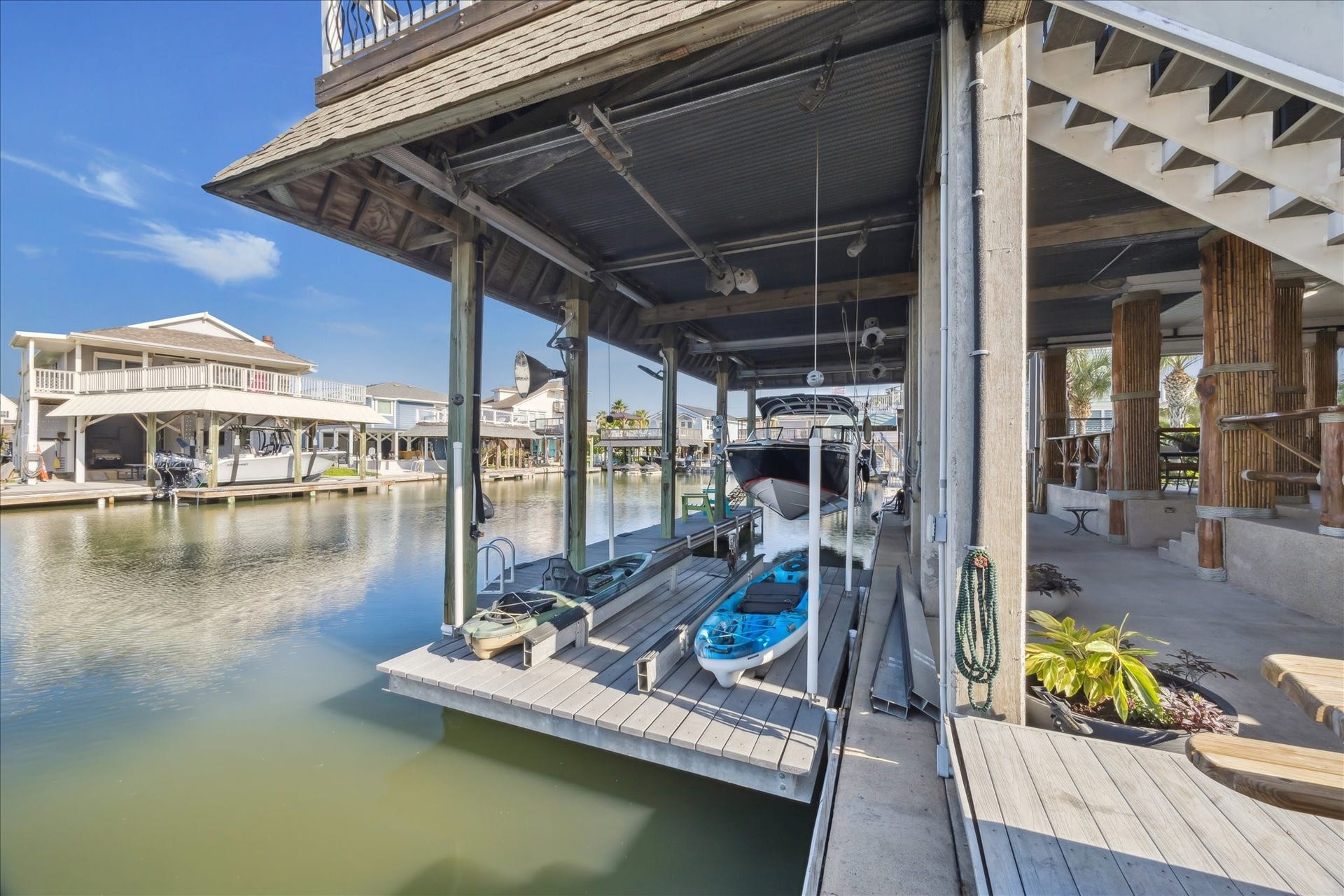 241 Tamana Drive, Tiki Island, TX 77554 jet ski lift/small boat lift/or paddle boat lift also has the larger boat lift nearby and don't forget all the extra offshore boat parking available.