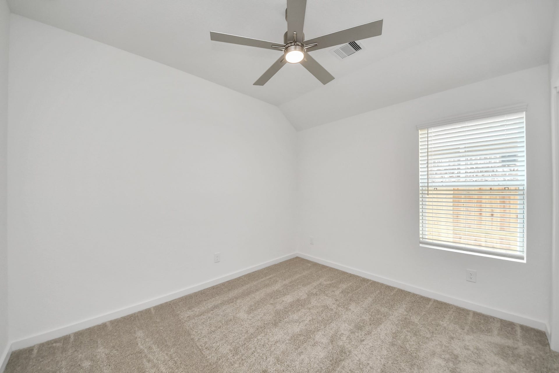 5834 Madison Trail Drive, Richmond, TX 77469 Secondary bedroom features plush carpeting, large windows that let in plenty of natural light, bright paint, and spacious closets. Sample photo of completed home with similar floor plan. Actual colors and selections may vary.