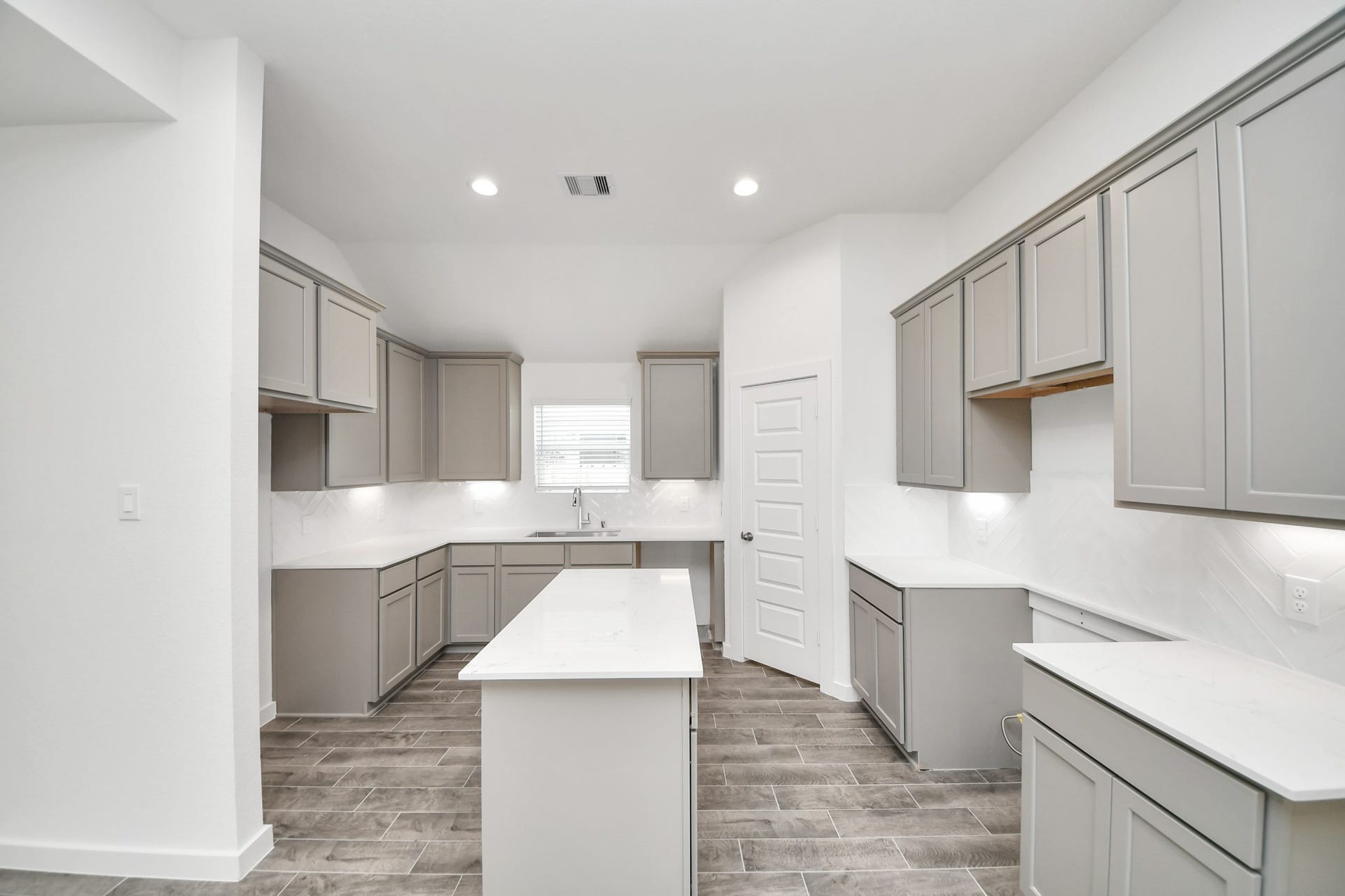 5834 Madison Trail Drive, Richmond, TX 77469 The kitchen is a culinary haven, featuring granite countertops, a tile backsplash, stainless steel appliances, 42 upper cabinets, and undercabinet lighting. Sample photo of completed home with similar floor plan. Actual colors and selections may vary.