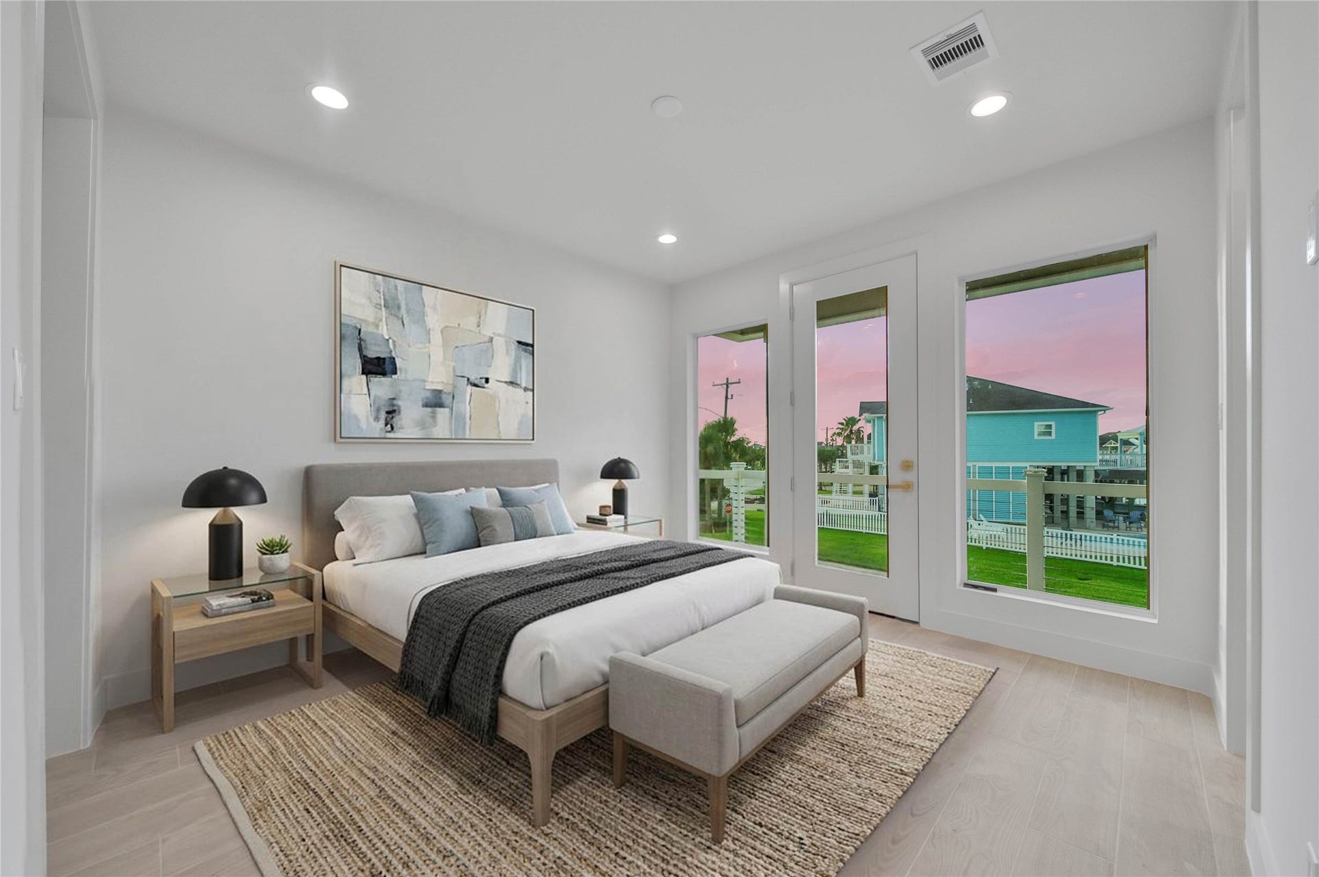 243 Bamaku Bend, Tiki Island, TX 77554 One of Four spacious secondary bedrooms offering light floors, high ceilings, recessed lighting, en suite and access to exterior balcony. *virtually staged*