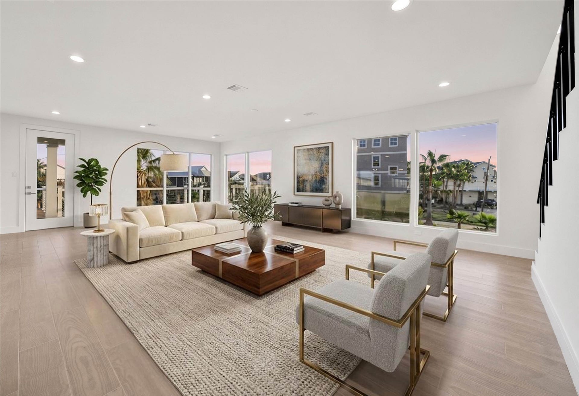 243 Bamaku Bend, Tiki Island, TX 77554 Open living space surrounded by windows that fill the room with natural light and showcase the views. Door leads to the amazing second floor deck for easy indoor/outdoor entertaining! *virtually staged*