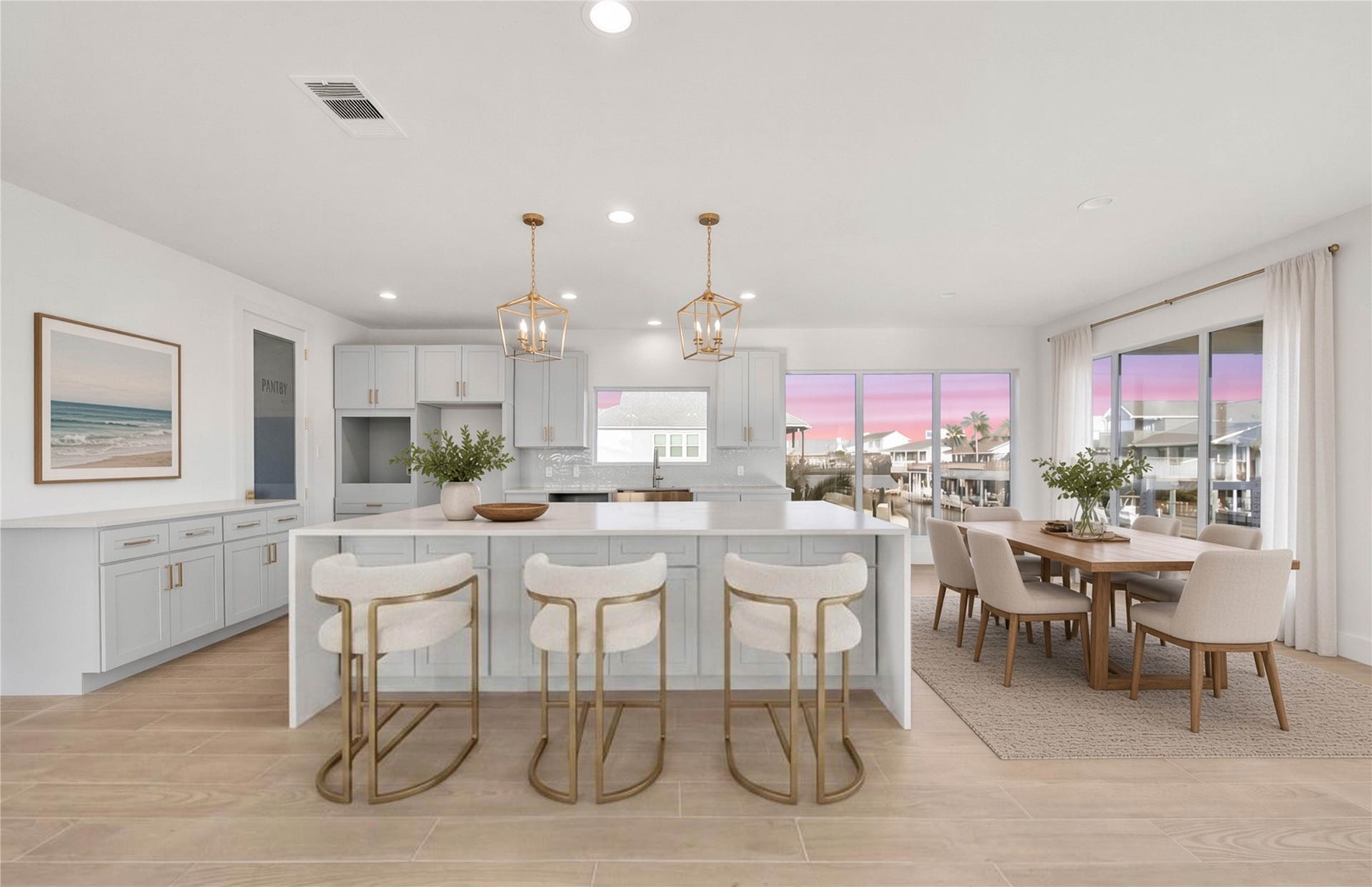 243 Bamaku Bend, Tiki Island, TX 77554 Completely remodeled from the ground up, this light-filled kitchen features an open layout, spacious island, and breathtaking views of the canal. *virtually staged*
