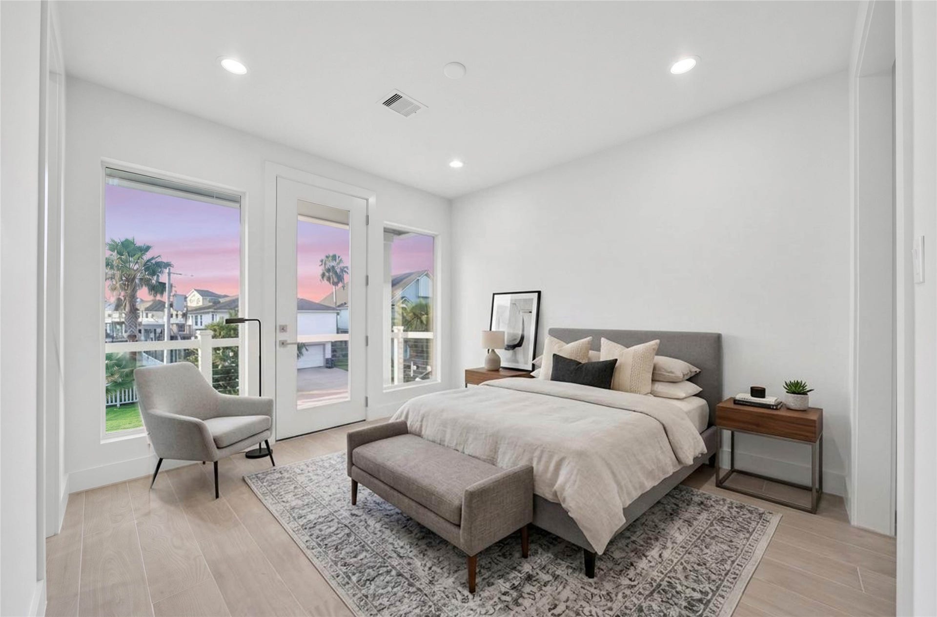 243 Bamaku Bend, Tiki Island, TX 77554 One of Four spacious secondary bedrooms offering light floors, high ceilings, recessed lighting, en suite and access to exterior balcony. *virtually staged*