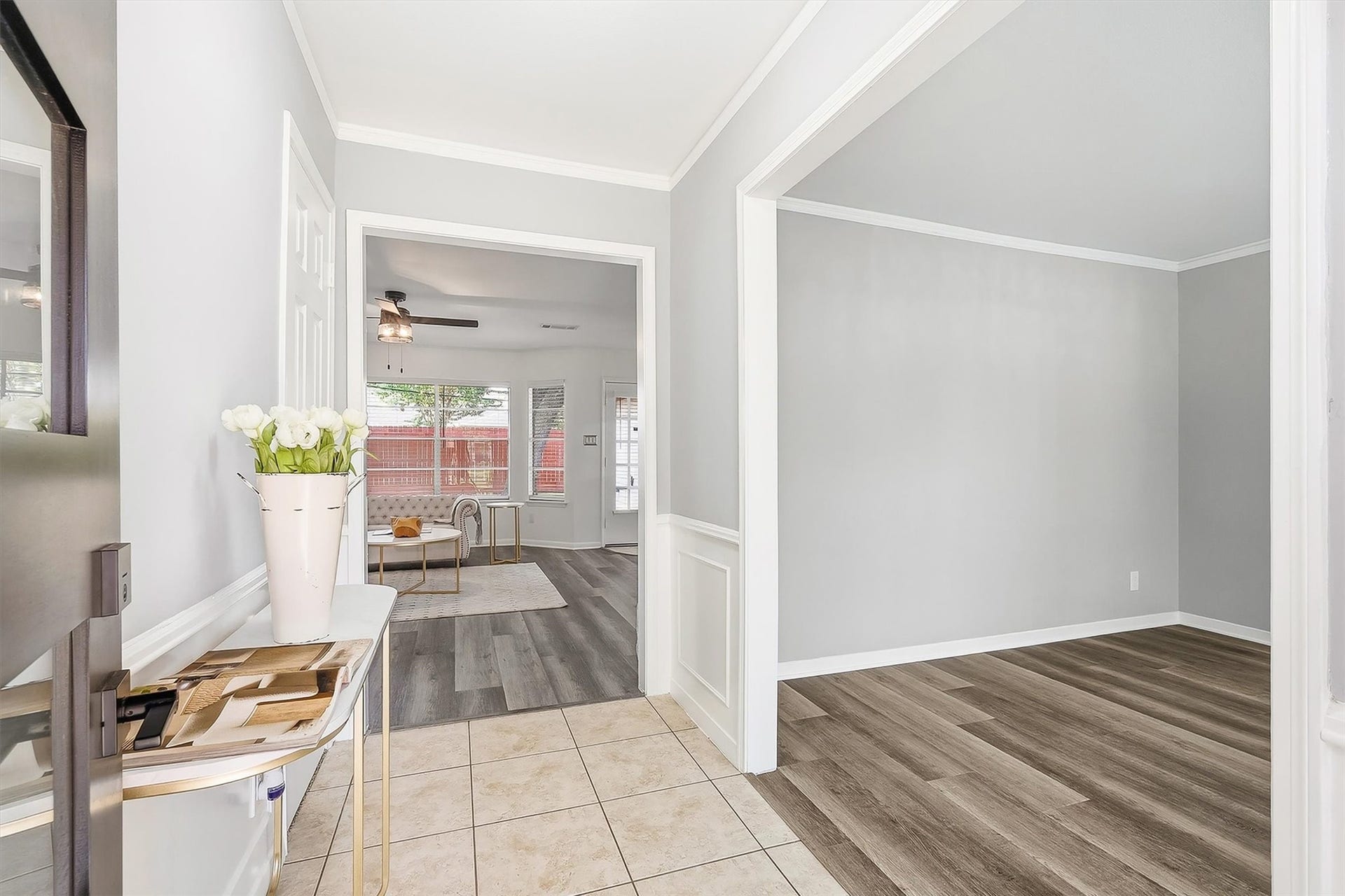 2503 Moss Hill Drive, Houston, TX 77080 Bright and inviting entryway with elegant tile flooring, leading to a cozy living space with natural light and modern finishes.