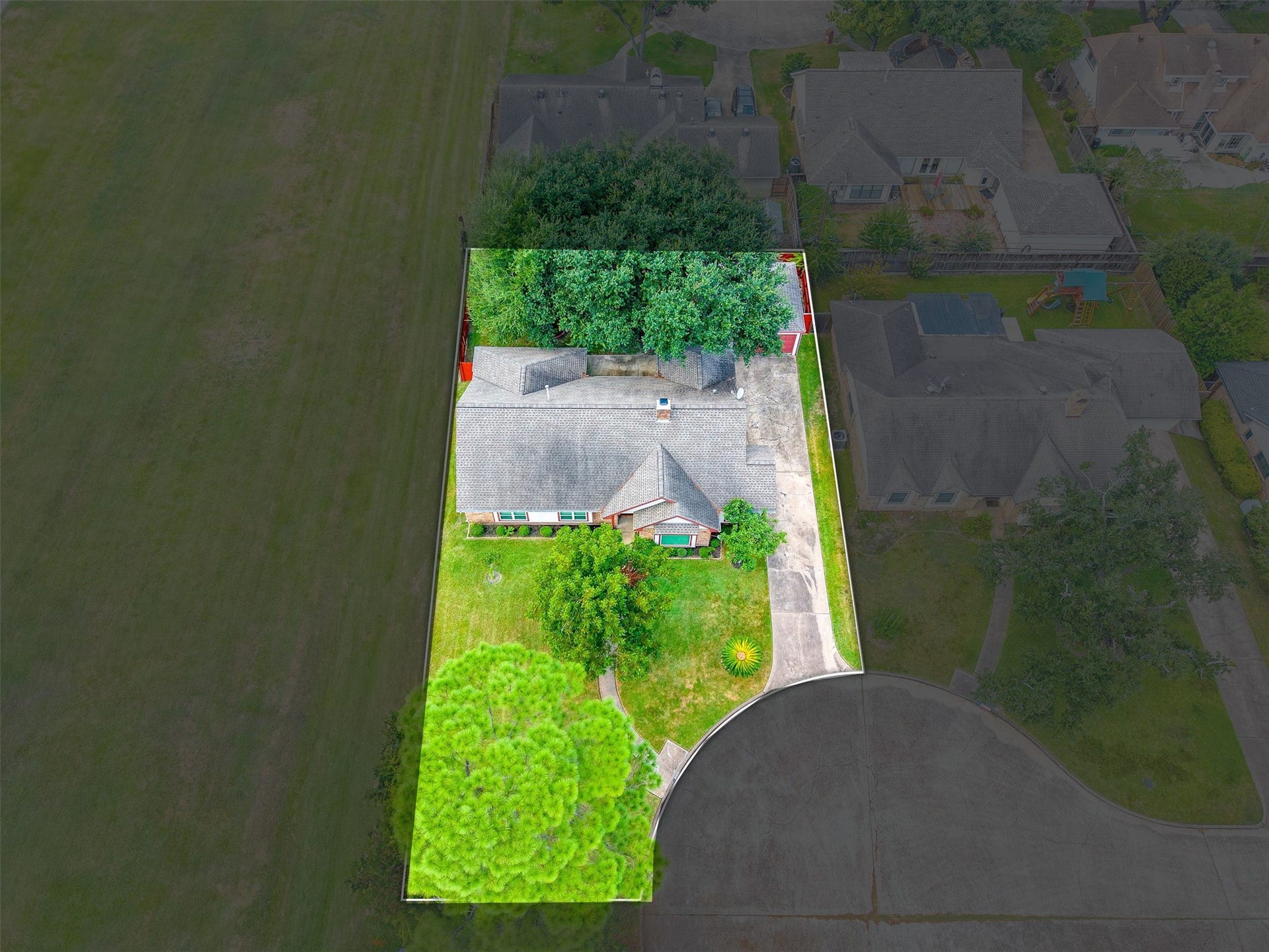 2503 Moss Hill Drive, Houston, TX 77080 Charming single-story home with a brick and siding exterior, featuring a beautifully manicured lawn and mature trees for added curb appeal.