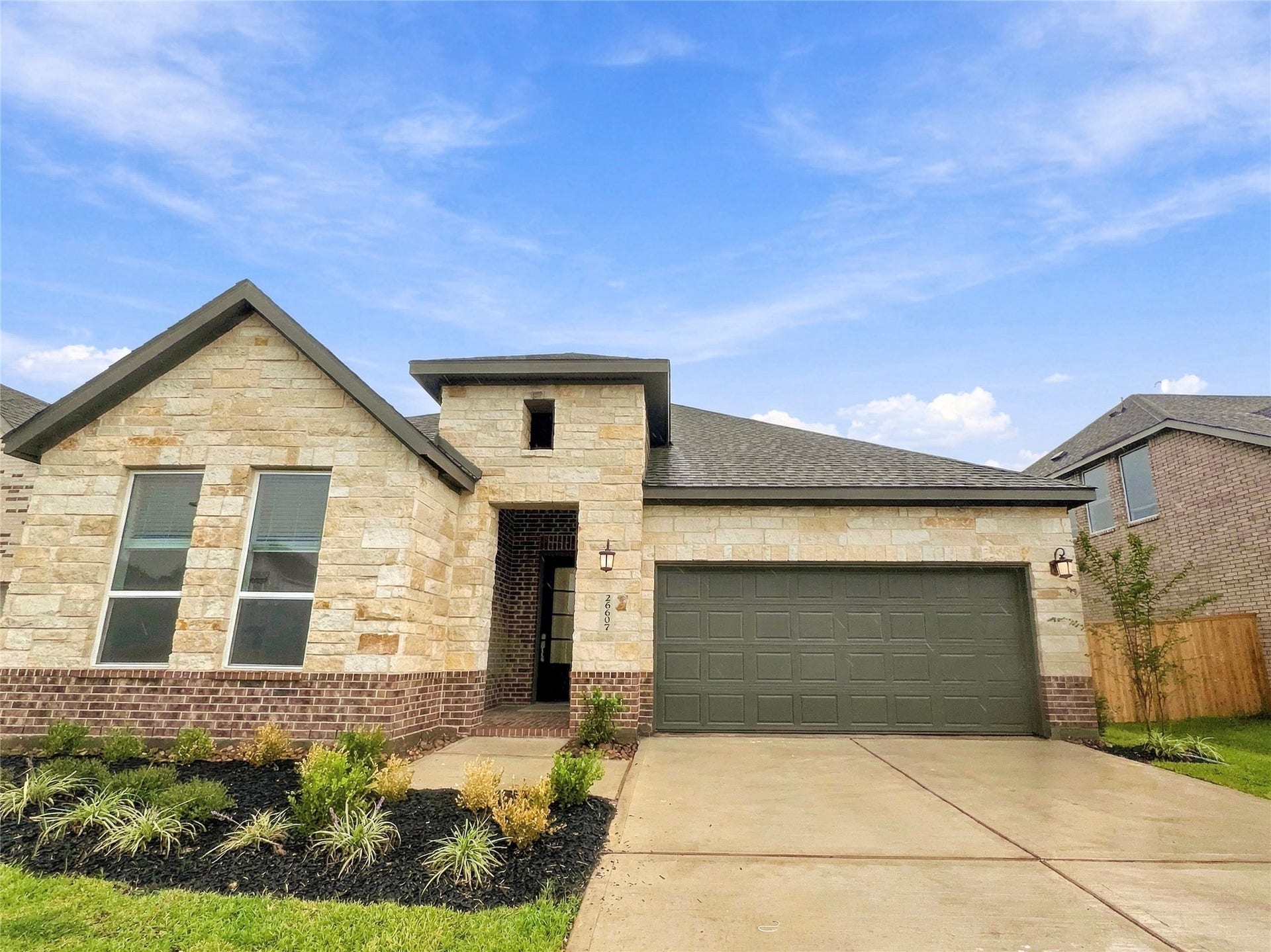 26607 Golden Heather Lane, Katy, TX 77493 Brick and stone single-story home with 2-car garage