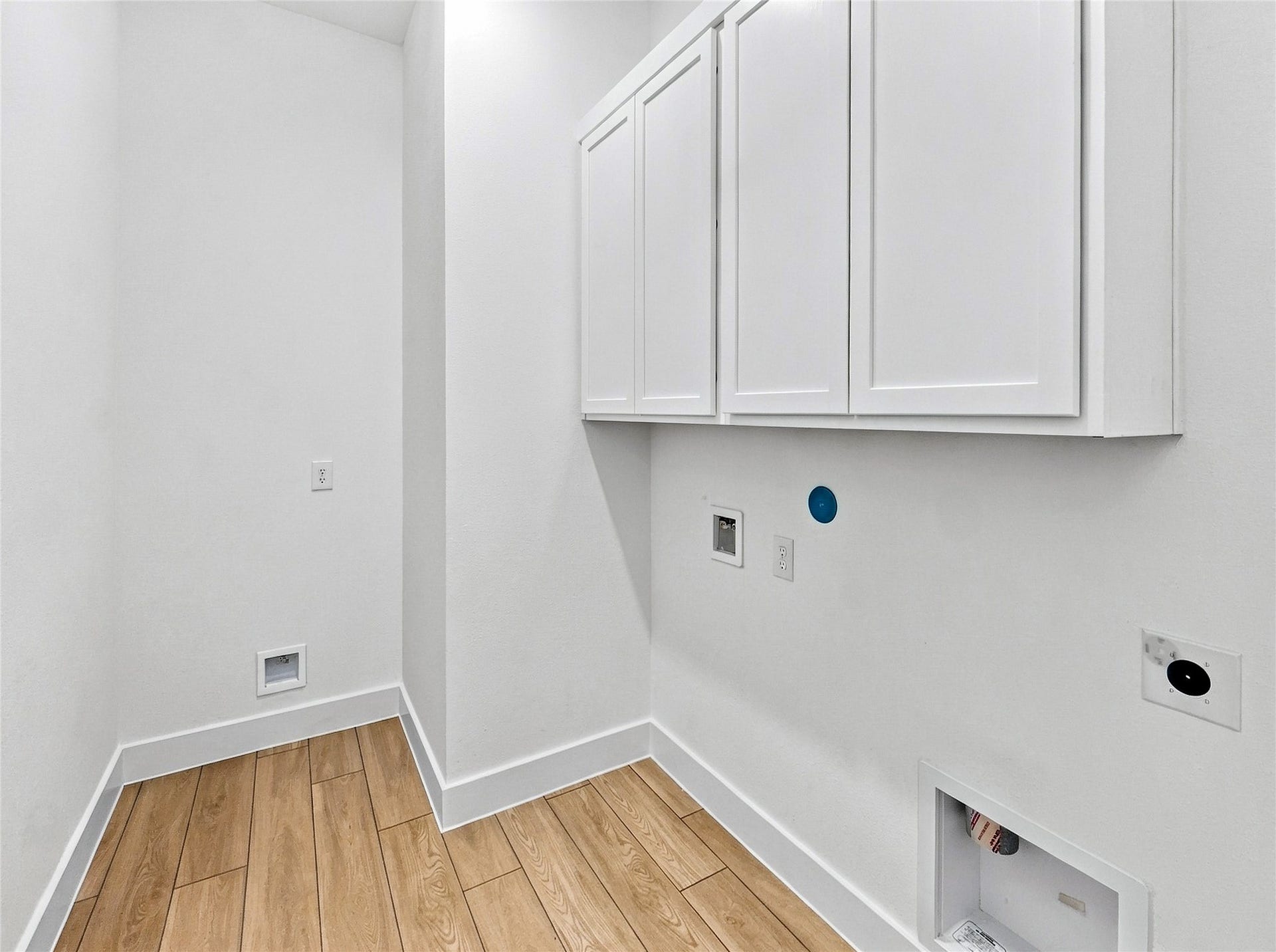 26607 Golden Heather Lane, Katy, TX 77493 Utility room with cabinets and gas or electric dryer hookups