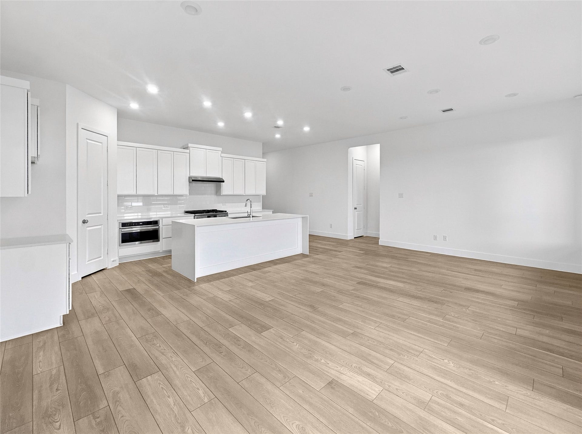 26607 Golden Heather Lane, Katy, TX 77493 Open layout with luxury vinyl plank flooring