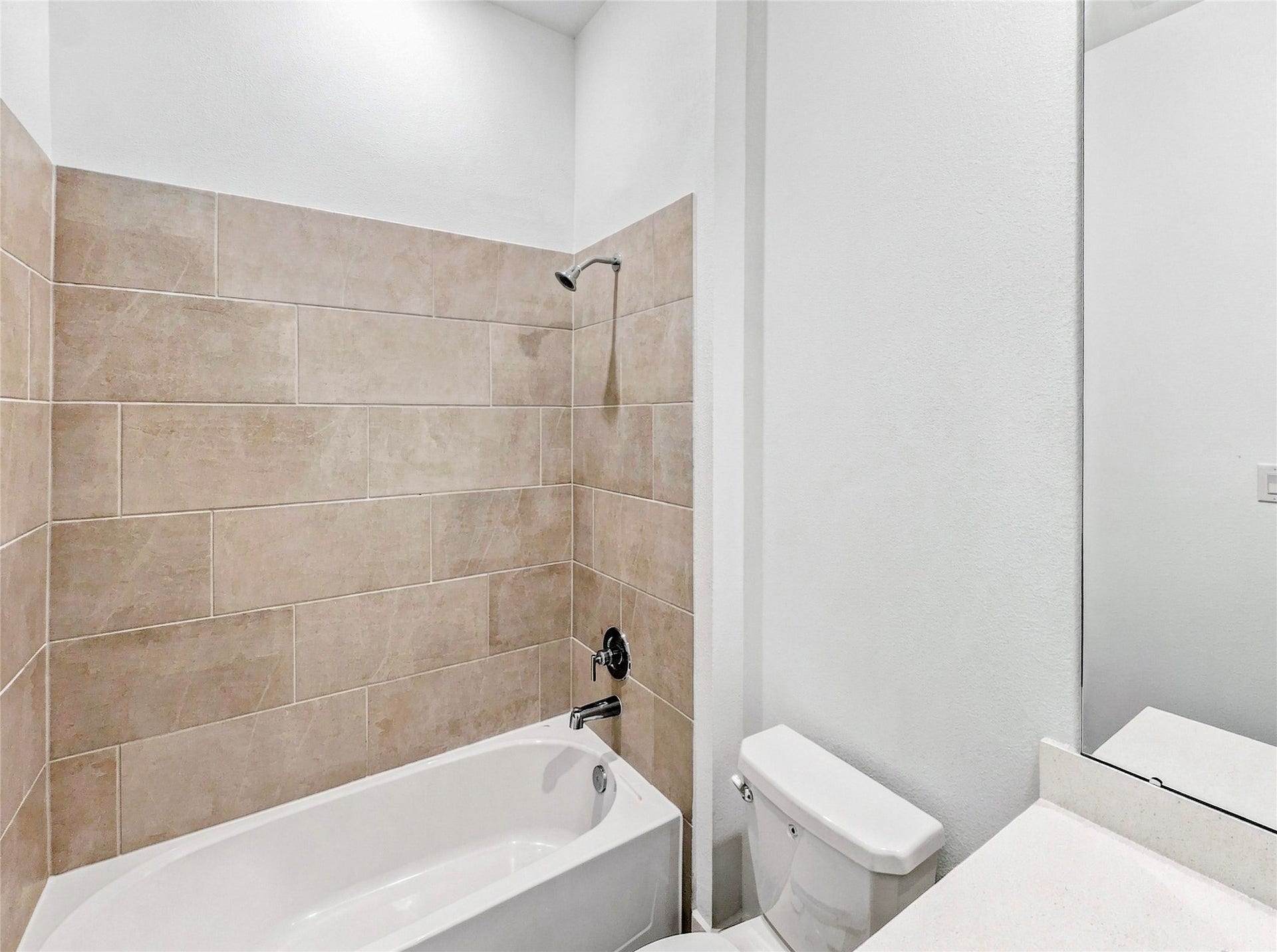 26607 Golden Heather Lane, Katy, TX 77493 Full bath with tub/shower combo and tile surround
