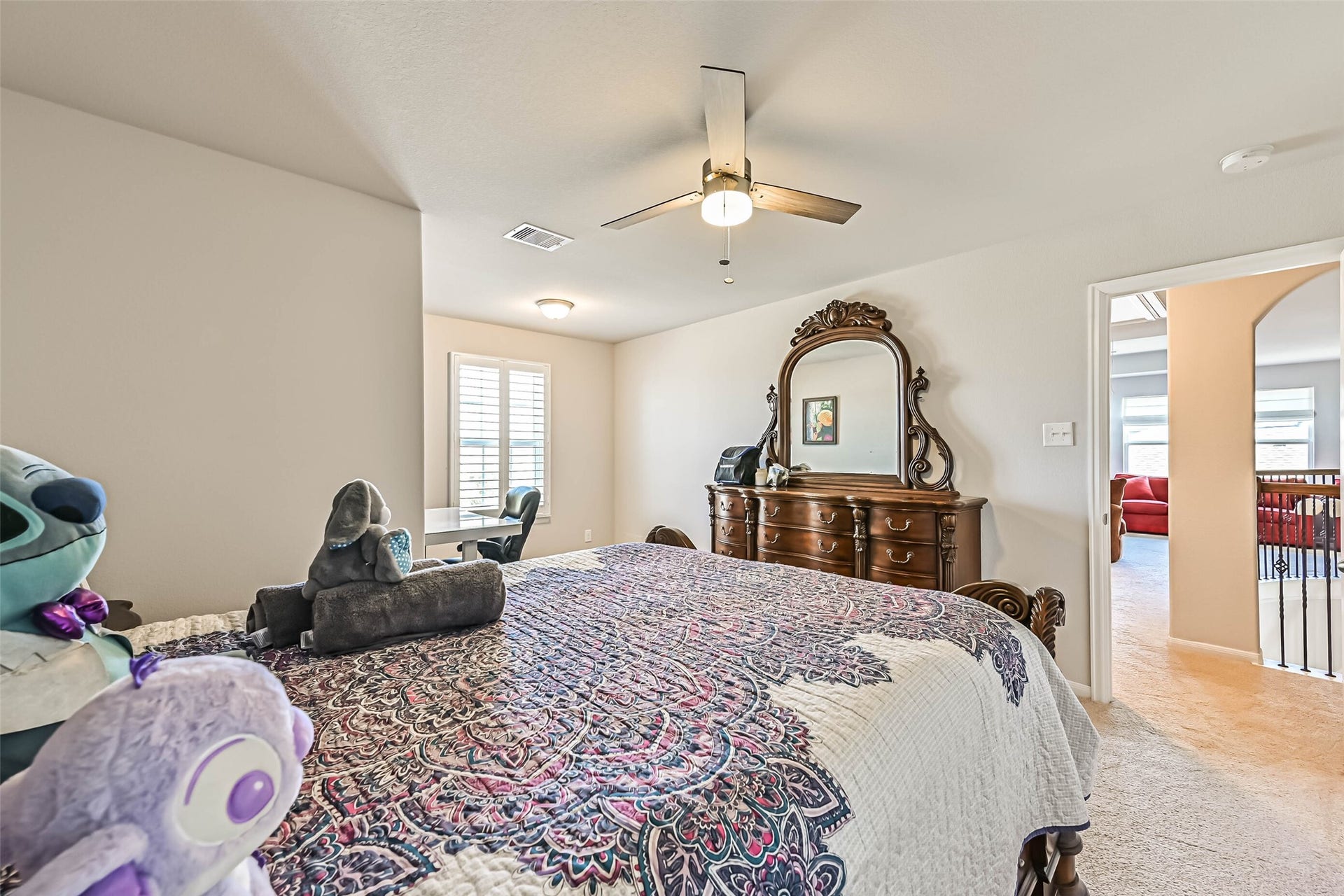 12527 Jetty Cove Drive, Texas City, TX 77568 Additional view highlighting the bedroom's spacious layout, natural light, and versatile furniture arrangement.