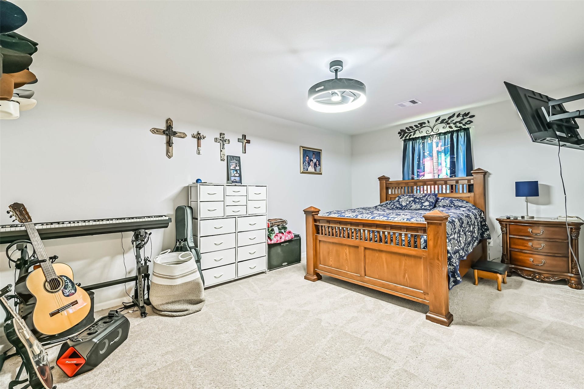 12527 Jetty Cove Drive, Texas City, TX 77568 Another view of the spacious secondary bedroom featuring a modern ceiling fan, neutral finishes, and plenty of room for additional furniture or a workspace.