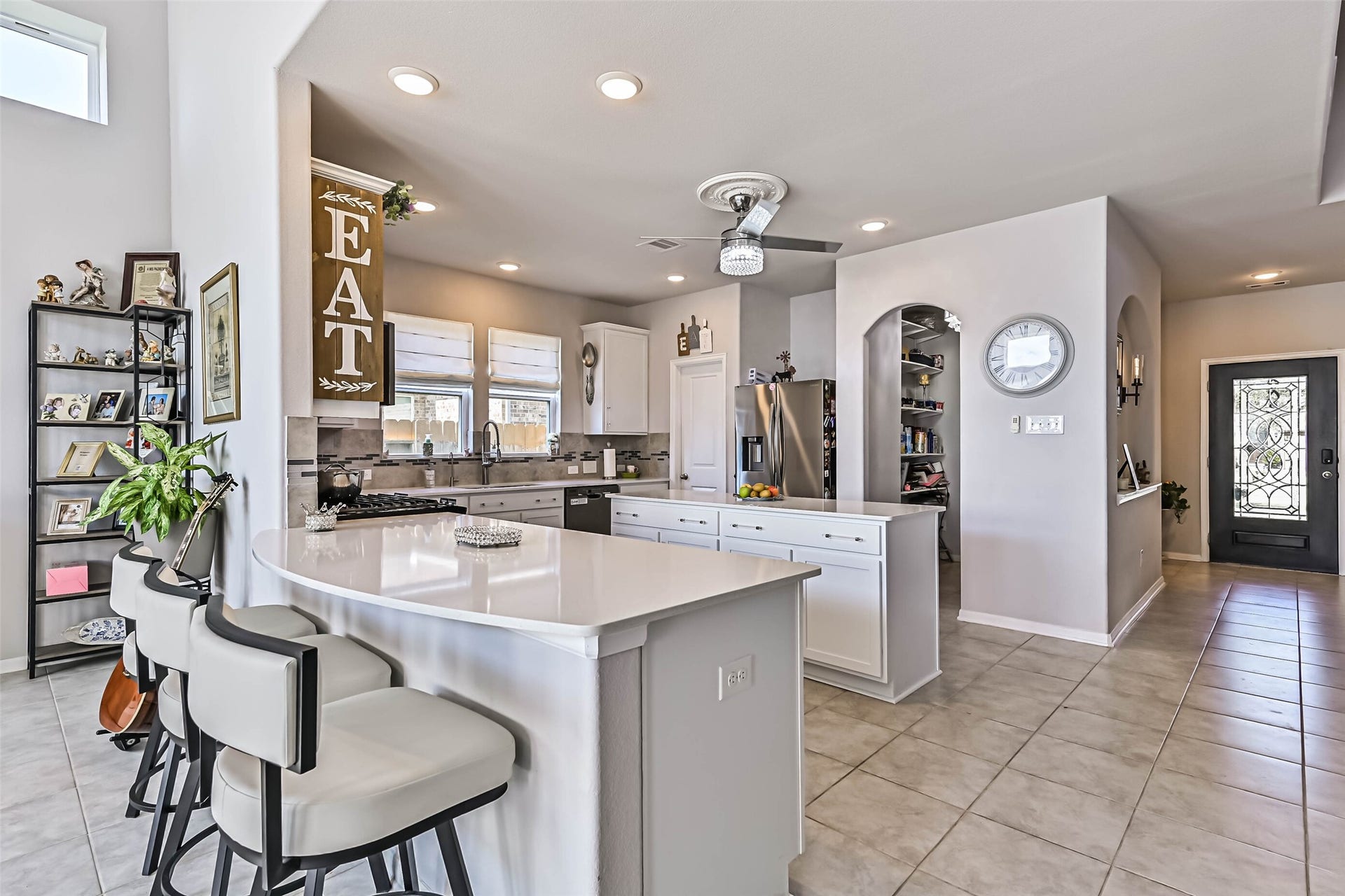 12527 Jetty Cove Drive, Texas City, TX 77568 Beautiful open-concept kitchen overlooking the spacious living area, featuring white cabinetry, generous counter space, and abundant natural light.