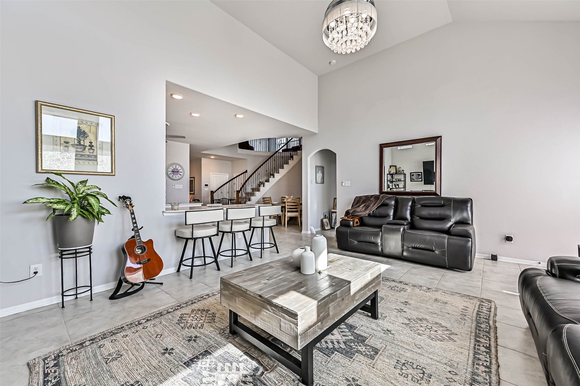 12527 Jetty Cove Drive, Texas City, TX 77568 Additional living room view highlighting the open floor plan, high ceilings, and convenient access to the kitchen and dining area.