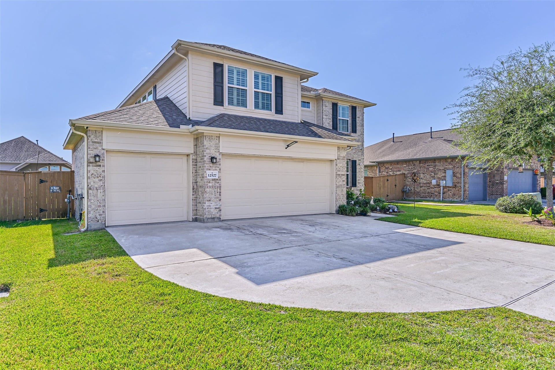 12527 Jetty Cove Drive, Texas City, TX 77568 Beautiful two-story home featuring a combination of brick and siding, attractive curb appeal, and a three-car garage.