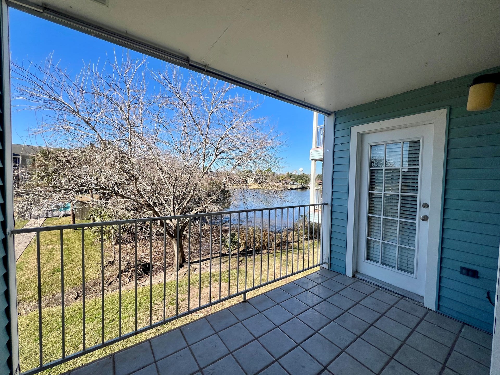 18617 Egret Bay Boulevard, #1001, Webster, TX 77058 Private patio with access from living room, and primary bedroom. Water view.