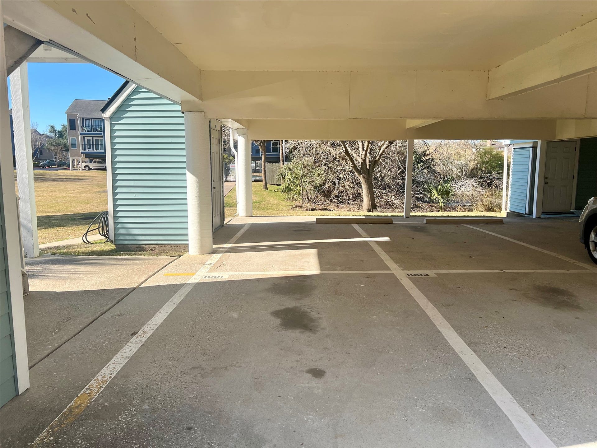 18617 Egret Bay Boulevard, #1001, Webster, TX 77058 Two covered parking spots by stairs to access condo. Along with a storage closet on ground level.