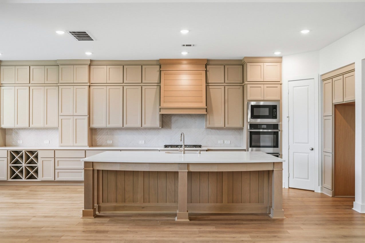 1535 Watermont Drive, Missouri City, TX 77459 Bright gourmet kitchen with abundant cabinetry, a spacious island, and an open layout.