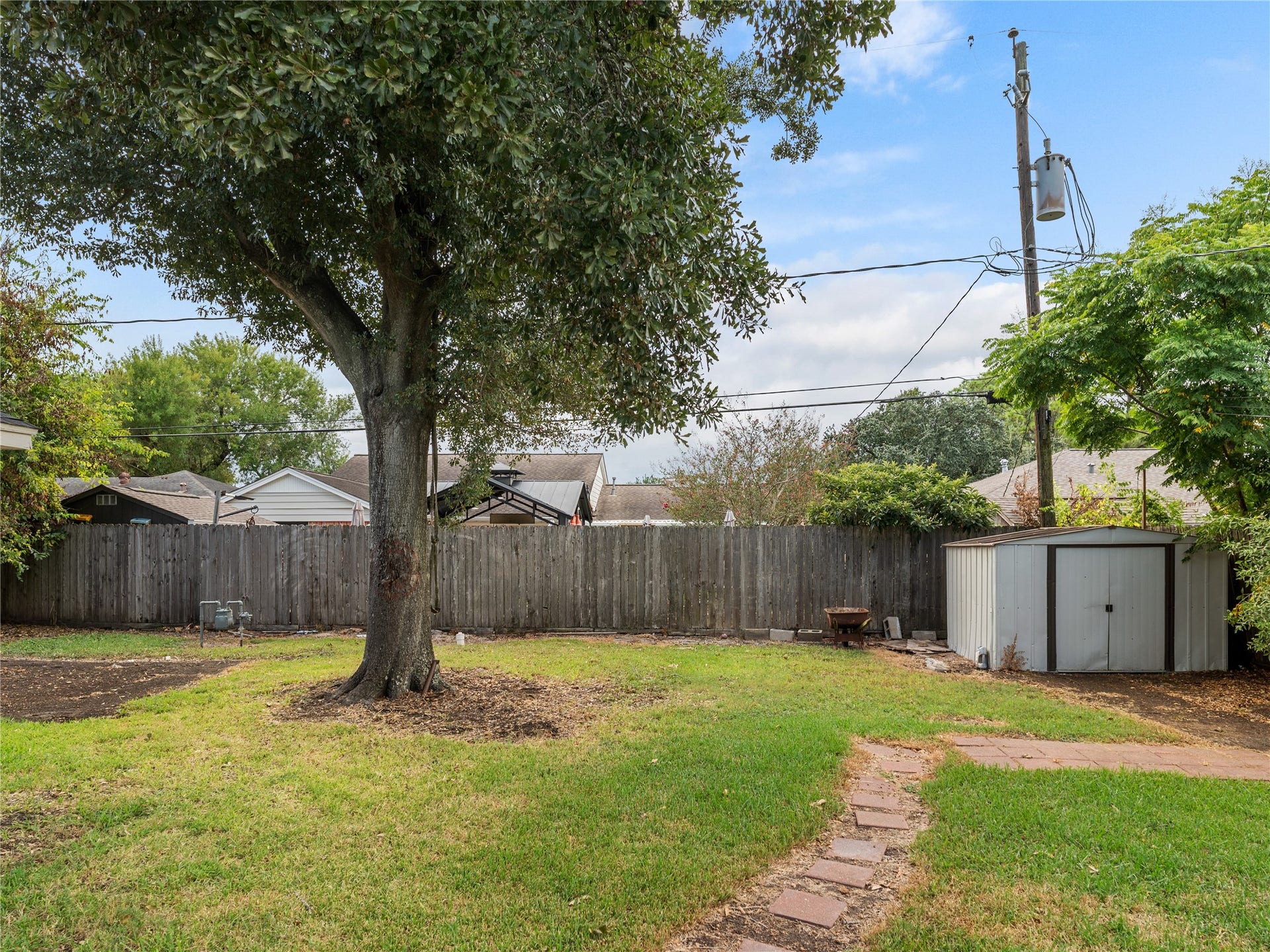 2408 Blueberry Lane, Pasadena, TX 77502 Backyard featuring storage shed