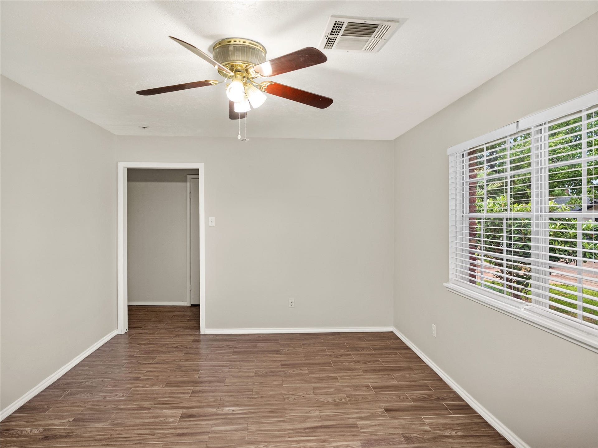 2408 Blueberry Lane, Pasadena, TX 77502 Bright living area with wood-look flooring