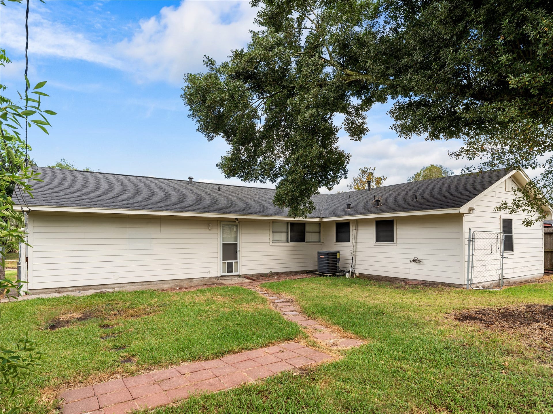 2408 Blueberry Lane, Pasadena, TX 77502 Rear exterior and backyard walkway