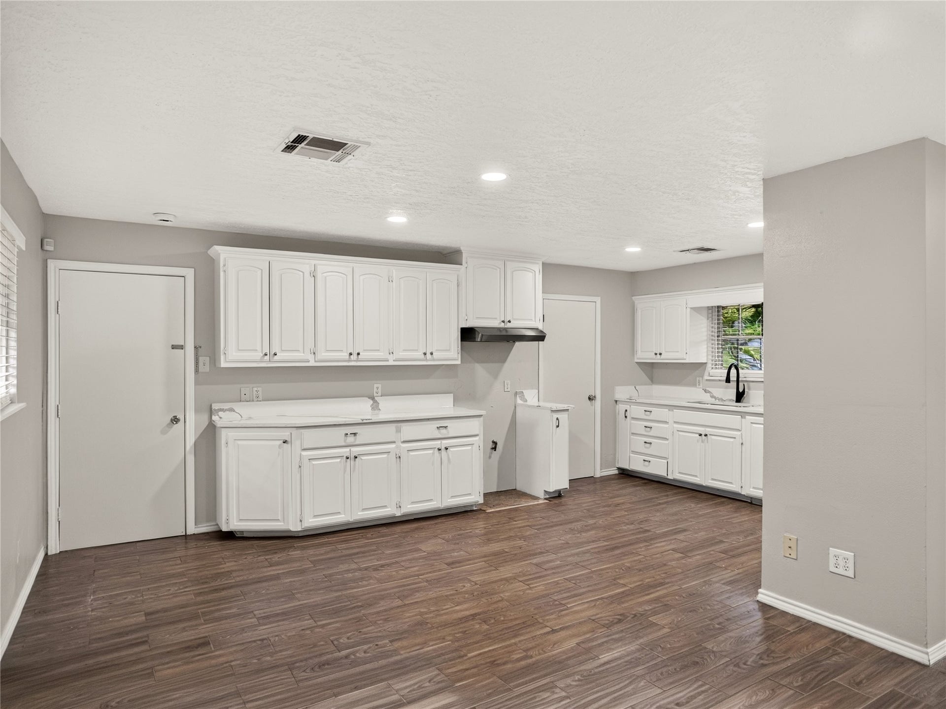 2408 Blueberry Lane, Pasadena, TX 77502 Kitchen featuring white cabinetry and updated QUARTZ countertops