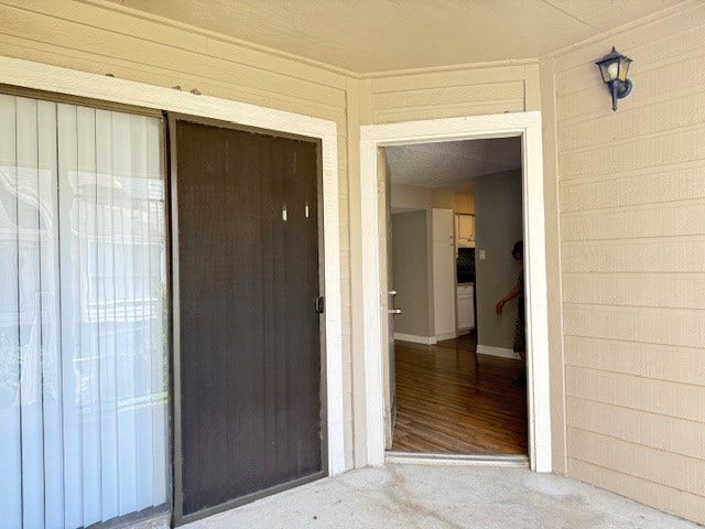 6701 Sands Point Drive, #26, Houston, TX 77074 Front door to unit. Sliding doors are in the flex room.