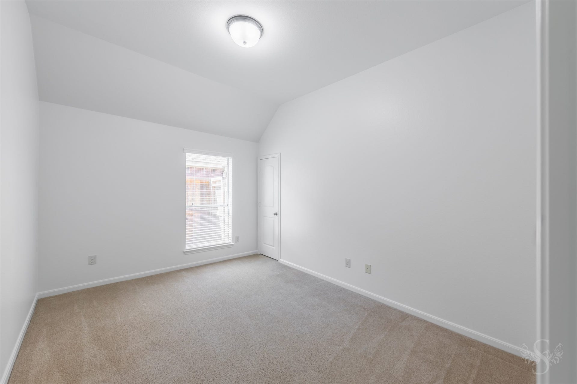 28015 Barberry Banks Lane, Fulshear, TX 77441 This secondary bedroom features elevated ceilings, plush carpeting and a large window that bring in soft natural light. Generous space and a comfortable layout make it ideal for family or guests.
