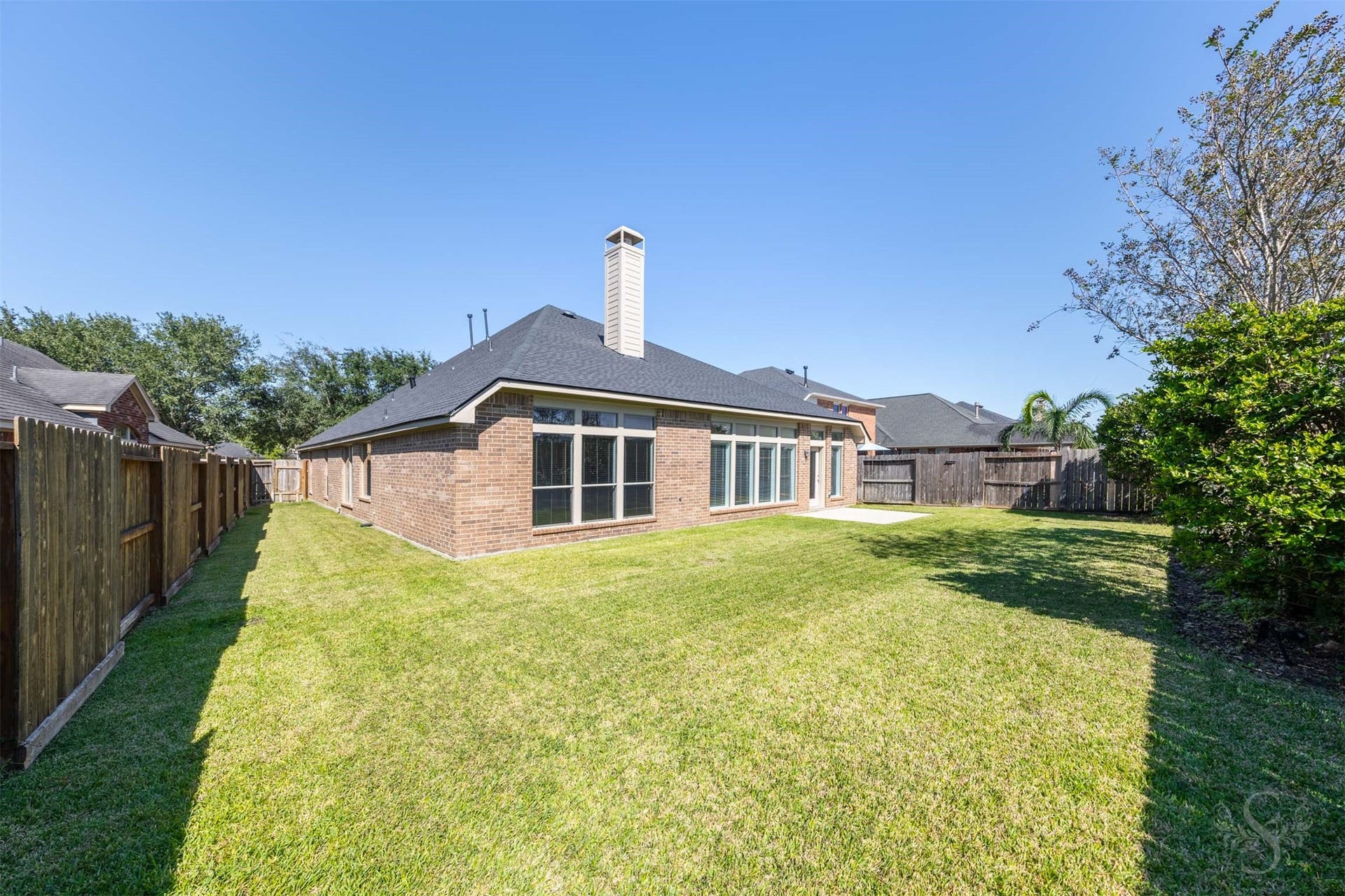 28015 Barberry Banks Lane, Fulshear, TX 77441 The expansive backyard offers a lush lawn and beautiful landscaping, creating a peaceful outdoor setting. Mature plantings add color and privacy while leaving plenty of room for recreation.