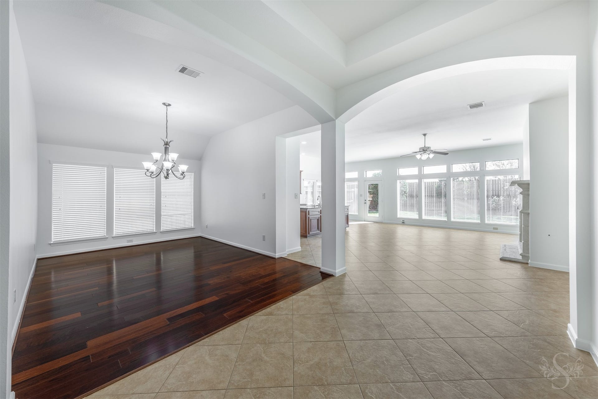 28015 Barberry Banks Lane, Fulshear, TX 77441 Framed by elegant archways, the formal dining room offers a spacious setting for gatherings while remaining seamlessly connected to the heart of the home. Rich wood floors, elevated ceilings and wide sightlines enhance the homes open, inviting design.