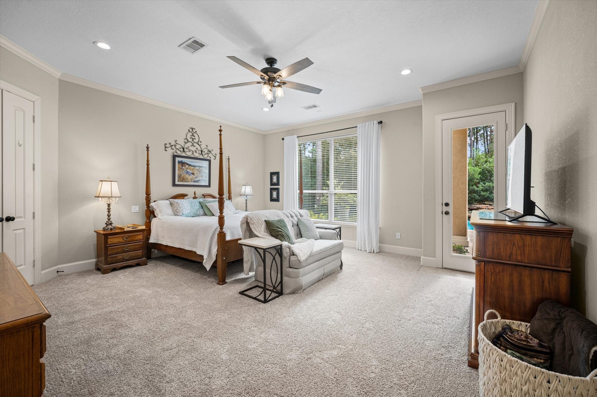 25815 Bridle Creek Drive S, Magnolia, TX 77355 Huge primary bedroom with a door to the outside to enjoy the oasis backyard.